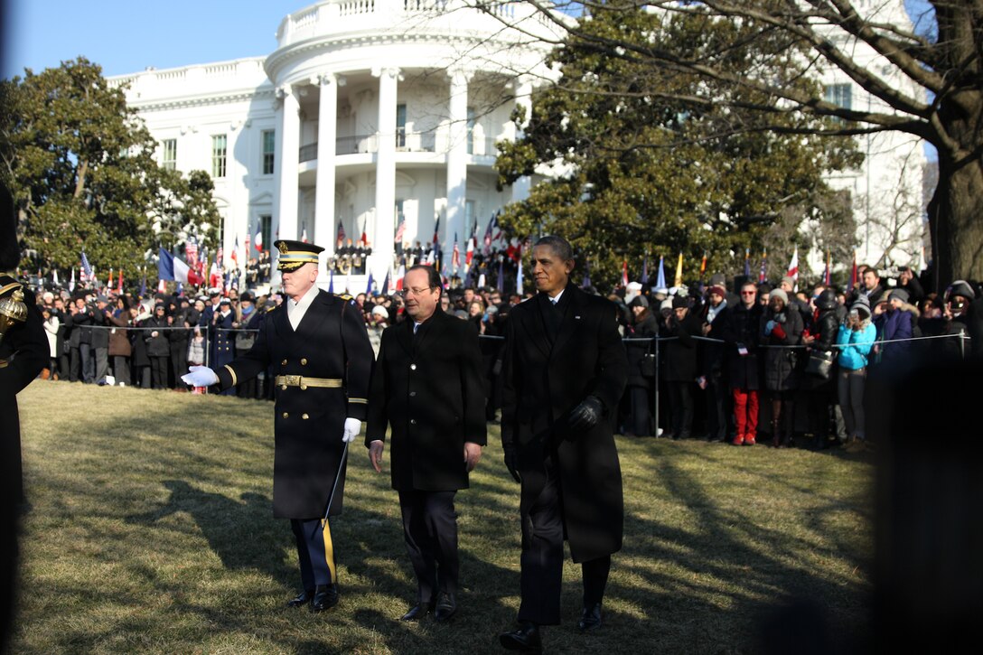 The Marine Band, led by Drum Major Master Gunnery Sgt. William L. Browne, performed for the State Arrival of His Excellency Francois Hollande, President of the French Republic on Feb. 11, 2014, on the South Lawn of the White House. (U.S. Marine Corps photo by Master Sgt. Kristin S. duBois/released)