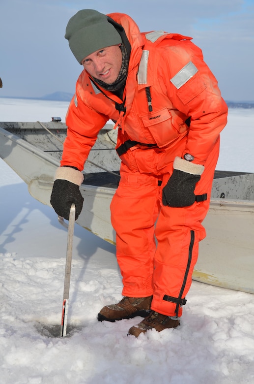 Al VanGuilder, from St. Paul District Operations Division, measures ice thickness on Lake Pepin near Wabasha, Minn., Feb. 13, 2013.