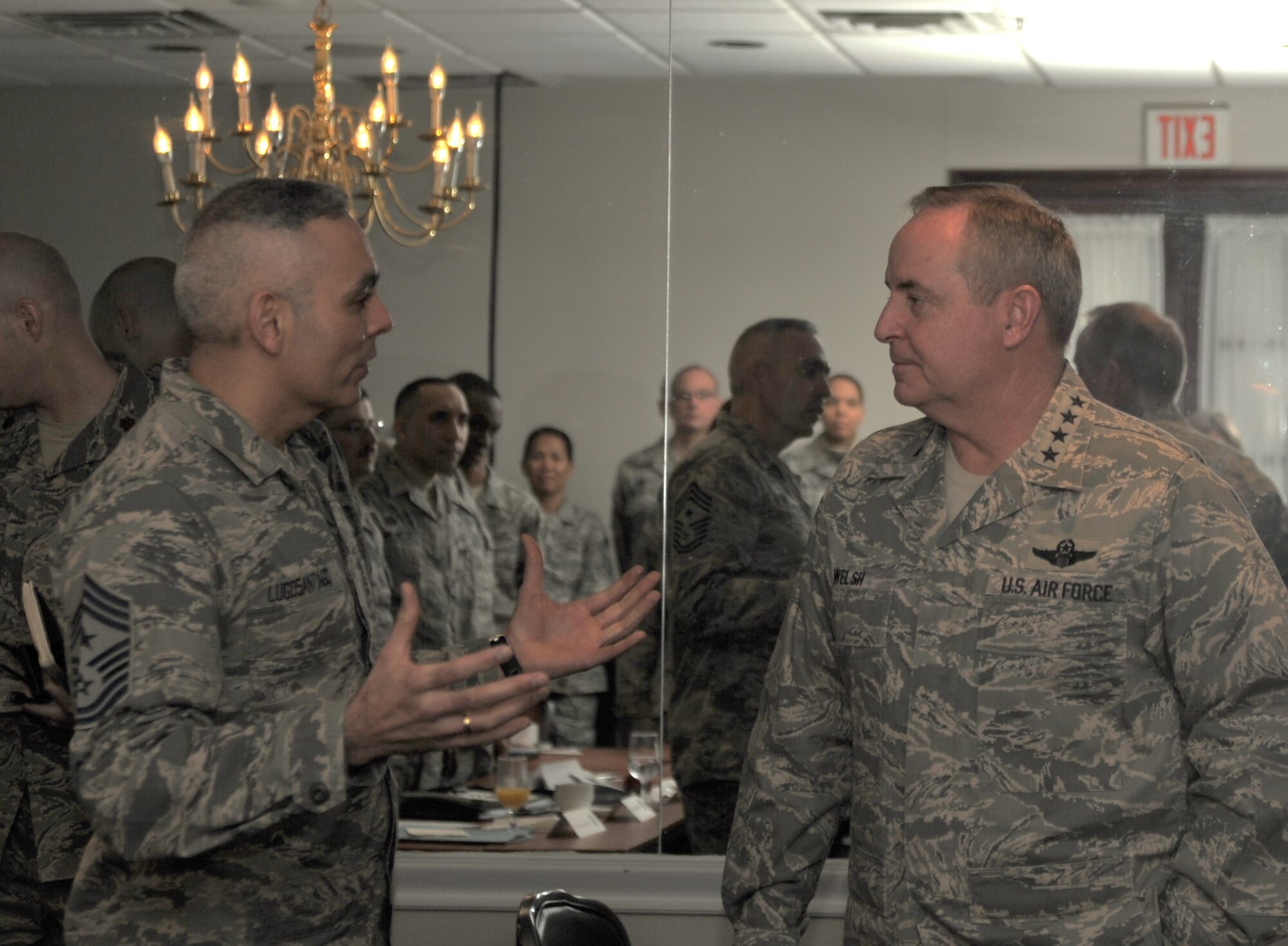 Air Force District of Washington Command Chief Master Sgt. Jose LugoSantiago talks to Air Force Chief of Staff Gen. Mark A. Welsh III following his remarks to the chief orientation seminar Feb. 7, 2014, at Joint Base Anacostia-Bolling, D.C. Chief master sergeant selects and new chief master sergeants assigned across the National Capital Region attended the five-day seminar. (U.S. Air Force photo/Master Sgt. Tammie Moore)