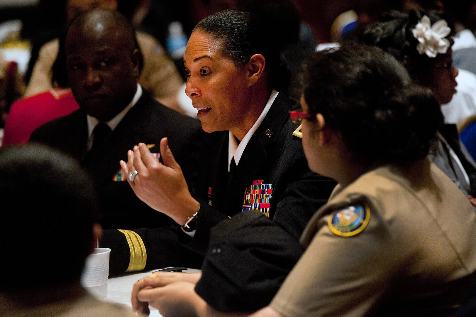 Army Brig. Gen. Linda Singh, the assistant adjutant general-Army with the Maryland National Guard, speaks with high school students during a youth mentorship in Washington, D.C., Feb. 7, 2014. The event was designed to foster a greater interest in science, technology, engineering and math among high school students--specifically minority students--and featured many senior military officials who spoke about their experiences and how science and technology impacted their lives.