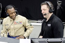 Sergeant Major Johnnie Hughes, Recruiting Station Kansas City sergeant major, and Mick Shaffer, a Kansas City Time Warner Cable Sports Channel on-air sports anchor, discuss many of the similarities between being a member of a basketball team and that of the Marine Corps during the Time Warner Cable Sports Channel Showcase at the Sprint Center here Jan. 20, 2014. Several male and female high school basketball teams from the greater Kansas City metropolitan area, such as the Wyandotte High School Bulldogs, Central Academy of Excellence Eagles and Raytown South High School Cardinals, competed in the showcase. 