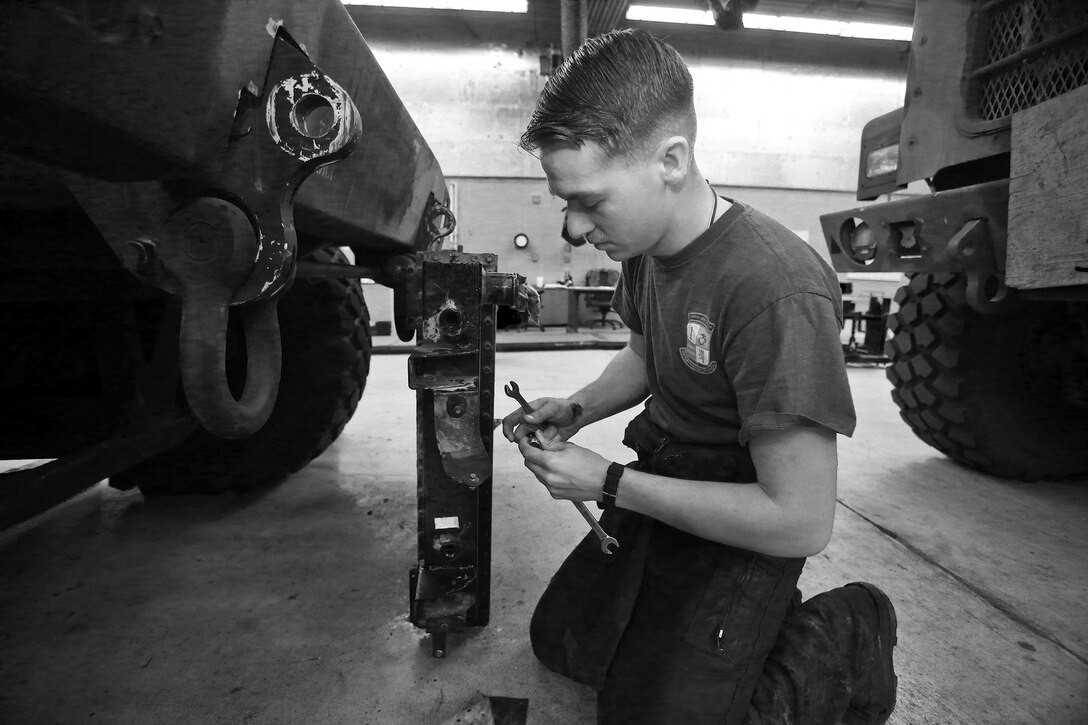 Corporal John J. Brady, automotive organizational mechanic, General Support and Motor Transportation Company, Combat Logistics Regiment 1, 1st Marine Logistics 
Group, works on a radiator at his regiment’s maintenance bay aboard Camp Pendleton, Calif., Feb. 6, 2014. Brady, a 23-year-old native of Ranchester, Wyo., is also the company’s hazmat noncommissioned officer. 