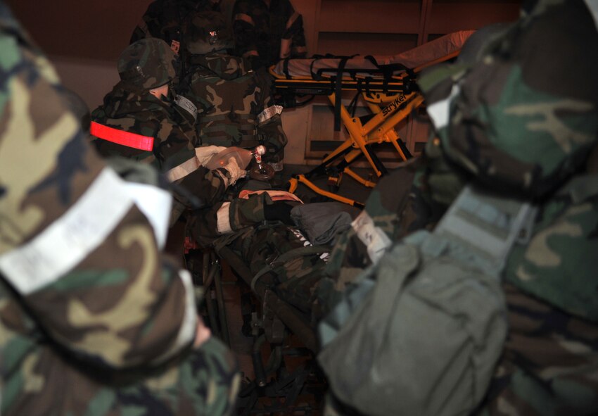 Airmen from the 51st Medical Group use a gurney to wheel a mock casualty into the 51st MDG Emergency Room during a medevac and dust-off scenario as part of Operational Readiness Exercise Beverly Midnight 14-02 at Osan Air Base, Republic of Korea, Feb. 12, 2014. This particular role player portrayed unconsciousness and other injuries during the scenario. (U.S. Air Force photo/Airman 1st Class Ashley J. Thum)