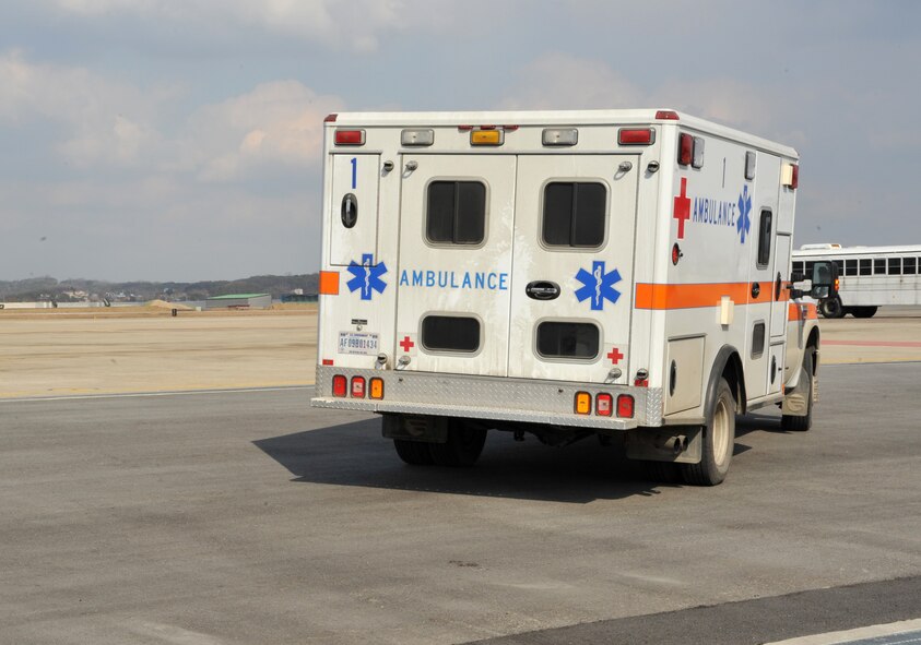 A 51st Medical Group ambulance leaves the flight line after picking up two mock casualties from a Black Hawk medevac helicopter from the 3rd General Support Aviation Battalion at U.S. Army Garrison Humphreys, Republic of Korea, during a medevac and dust-off scenario as part of Operational Readiness Exercise Beverly Midnight 14-02 at Osan Air Base, ROK, Feb. 12, 2014. OREs are a unique opportunity for medical personnel to participate in joint training with other branches of the military, mimicking operations in a real-world engagement. (U.S. Air Force photo/Airman 1st Class Ashley J. Thum)