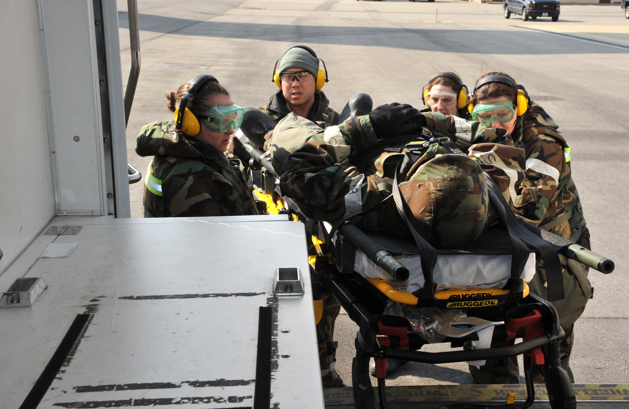 Members of the 51st Medical Group Field Response Team load a mock casualty into an ambulance during a medevac and dust-off scenario as part of Operational Readiness Exercise Beverly Midnight 14-02 at Osan Air Base, Republic of Korea, Feb. 12, 2014. The FRT’s ability to quickly and safely transport mock victims of a simulated ground engagement to the 51st MDG for treatment was tested during the scenario. (U.S. Air Force photo/Airman 1st Class Ashley J. Thum)