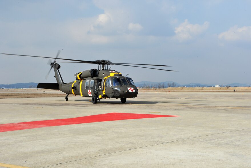 A Black Hawk medevac helicopter from the 3rd General Support Aviation Battalion at U.S. Army Garrison Humphreys, Republic of Korea, lands during a medevac and dust-off scenario as part of Operational Readiness Exercise Beverly Midnight 14-02 at Osan Air Base, ROK, Feb. 12, 2014. Soldiers from the 3-2 GSAB practiced picking up mock casualties from simulated ground engagements and transporting them to Osan for medical treatment. (U.S. Air Force photo/Airman 1st Class Ashley J. Thum)