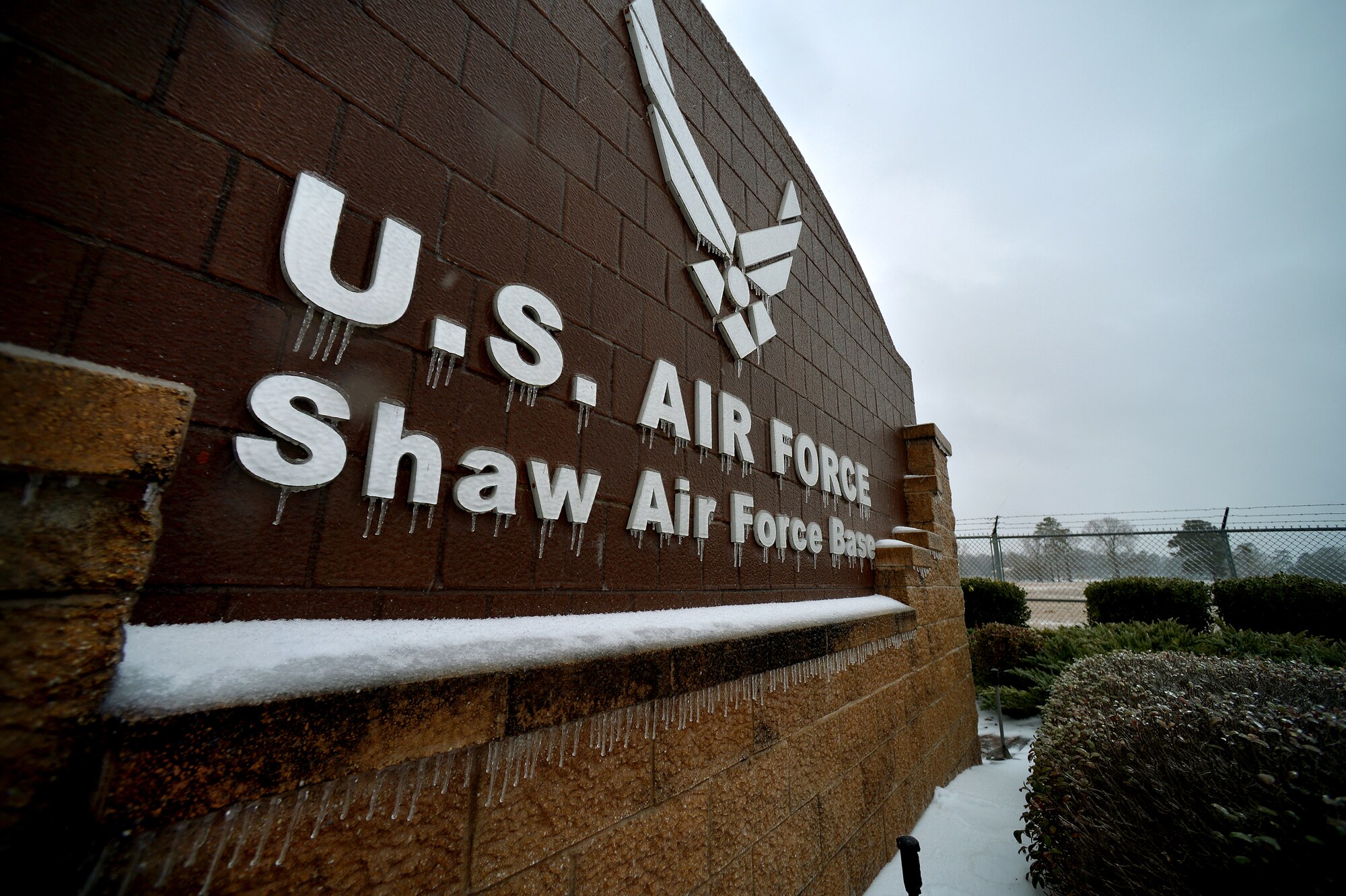 Icicles form on the Shaw Air Force Base main entrance stone display as temperatures drop and winter weather becomes more inclement, Feb. 12, 2014, Shaw Air Force Base, S.C. Though severe winter weather is rare at Shaw, this winter season has presented a fair amount of snow, sleet and ice. More than once this winter season, Shaw AFB has had to reduce its manning to "Mission Essential Personnel" only due to forecasted inclement weather. Team Shaw personnel are urged to stay off the roadways.  Also, the 20th Fighter Wing safety team reminds all personnel to refer to winter safety tips when operating in the inclement winter environment. (U.S. Air Force Photo by Staff Sgt. Kenny Holston/Released)