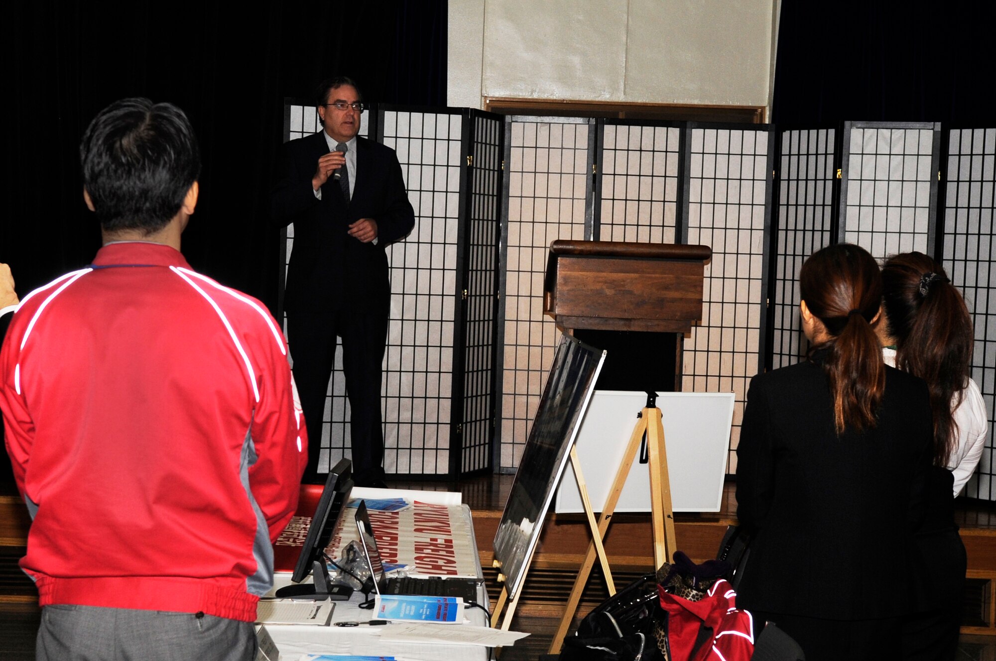 Alfred Magleby, American Consulate general, gives an opening speech for the fourth annual Okinawan First Vendor Showcase sponsored by the 18th Contracting Squadron and the Okinawa Industry Promotion Public Cooperation on Kadena Air Base, Japan, Feb. 6, 2014. The event allowed Government Purchase Card holders, unit resource advisors and military members a chance to meet local Okinawan companies and do business with them. (U.S. Air Force photo by Senior Airman Marcus Morris)