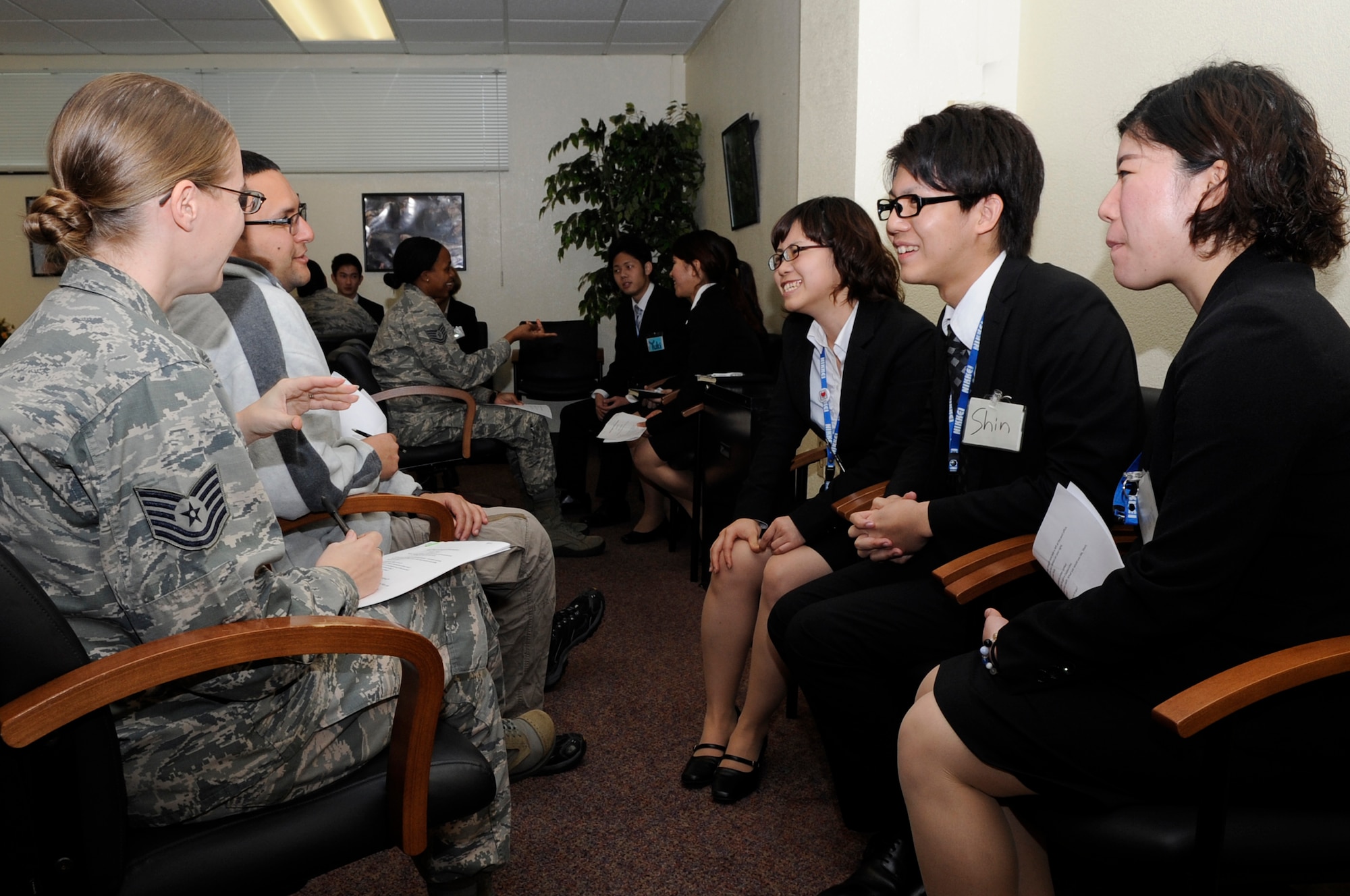 U.S. Air Force 18th Wing Airmen visit with students from the Nikkei College of Business in Okinawa City on Kadena Air Base, Japan, Feb. 5, 2014. The program focused on improving the students' English skills, while also giving them the opportunity to interact with Air Force members. (U.S. Air Force photo by Senior Airman Marcus Morris)
