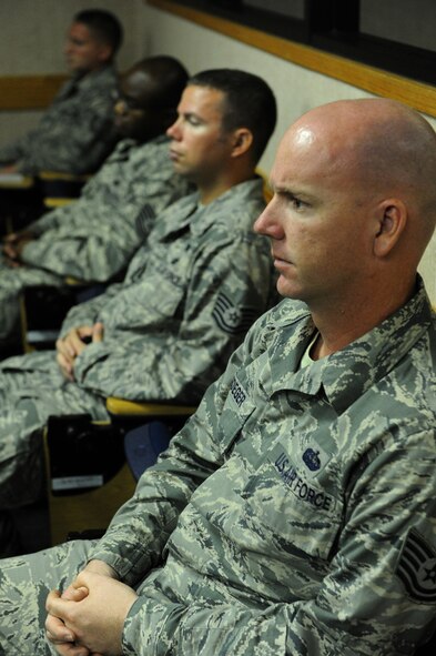 Non-Commissioned Officer Academy students from the Joint Base Pearl Harbor-Hickam, Binnicker Professional Military Education Center listen attentively as U.S. Navy Capt. (retired) Jerry Coffee, former Vietnam prisoner of war, speaks about his time over seven years spent in captivity during the Vietnamese War. (U.S. Air Force photo/Master Sgt. Jerome S. Tayborn)