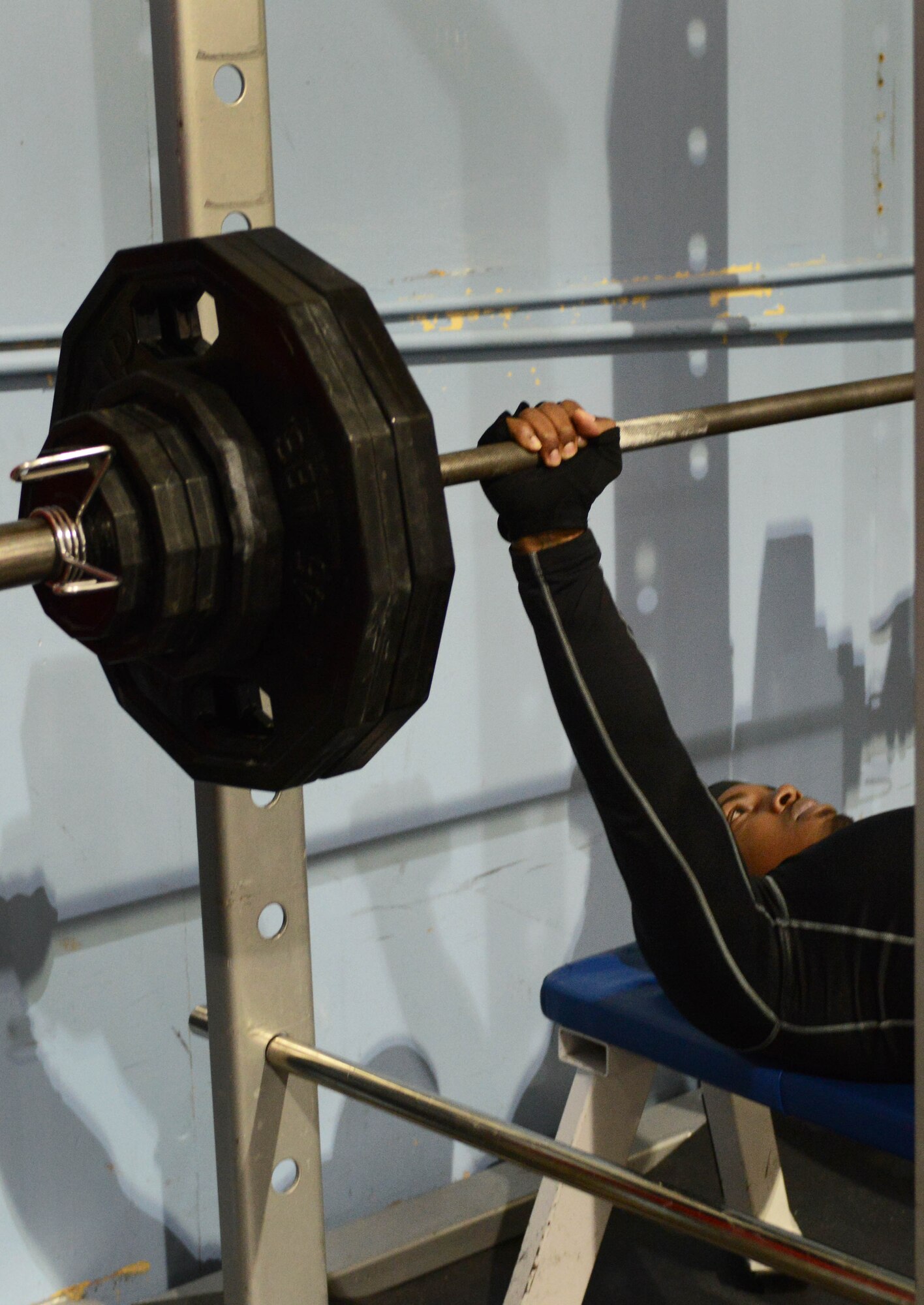 Thaxton Pennamon bench presses weights during the Strongman Competition on Mountain Home Air Force Base, Idaho, Feb. 6, 2014. Pennamon placed first not only in his weight division but also as the overall champion of the competition. (U.S. Air Force photo by Senior Airman Caitlin Guinazu/RELEASED)