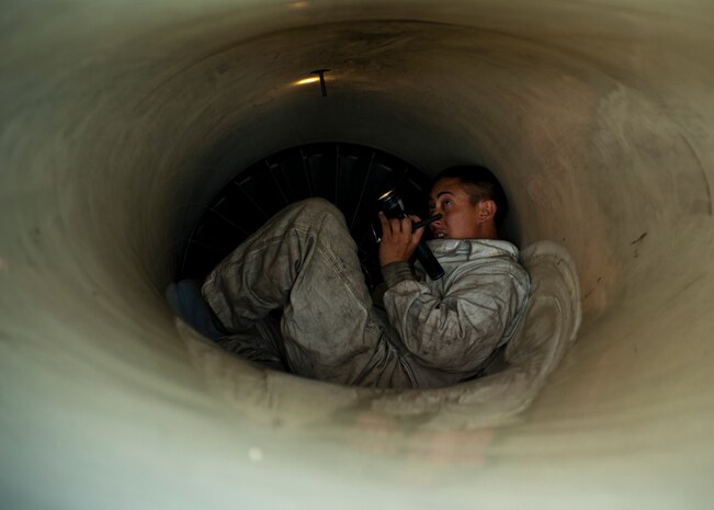 U.S. Air Force Staff Sgt. Jerry Conover, 57th Aircraft Maintenance Squadron Viper Aircraft Maintenance Unit crew chief, conducts an intake inspection on an F-16 Fighting Falcon Feb. 10, 2014 on the flight line at Nellis Air Force Base, Nev. Intake inspections are completed before every flight to ensure an aircraft’s intake is clear of cracks and debris. (U.S. Air Force photo by Airman 1st Class Timothy Young)