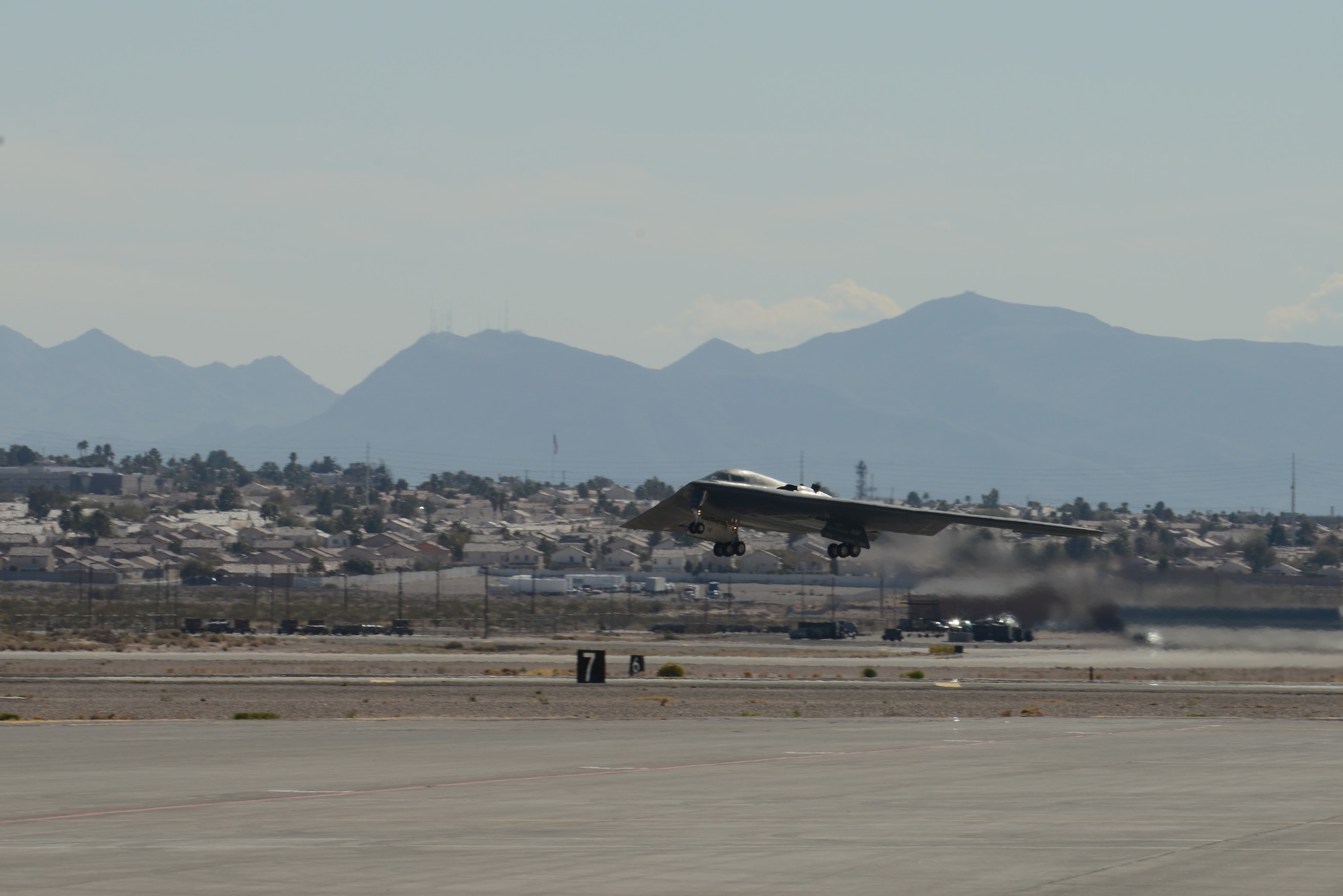 A B-2 Spirit from the 13th Bomb Squadron, Whiteman Air Force Base, Mo., takes off from the  runway at Nellis AFB, Nev., Feb. 4, 2014. The 13th BS is participating in the combat exercise Red Flag 14-1. The B-2 Spirit is a multi-role bomber capable of delivering both conventional and nuclear munitions. The U.S. Air Force’s premier exercise gives military members the opportunity to experience realistic, stressful combat situations in a controlled environment to increase their ability to complete missions and return home. (U.S. Air Force photo by Senior Airman Benjamin Sutton/Released)
