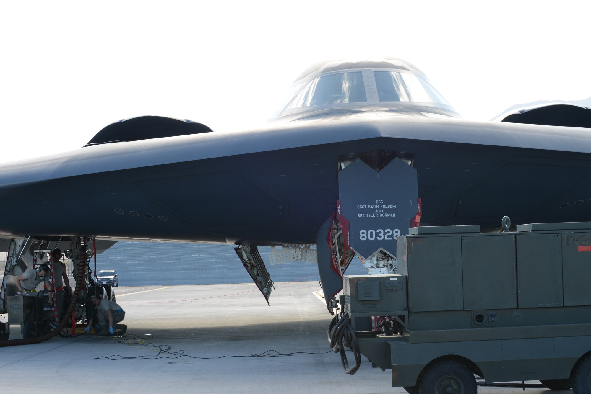 Members of the 509th Aircraft Maintenance Squadron from Whiteman Air Force Base, Mo., perform maintenance inspections on a B-2 Spirit Feb. 10, 2014, at Nellis AFB, Nev. The 509th AMXS is participating in Red Flag 14-1 to show what Global Strike stealth assets do when incorporated into the exercise’s mission planning. By providing realistic combat training in a contested, degraded and operationally limited environment, Red Flag 14-1 provides pilots with real-time war scenarios and helps ground crews test their readiness capabilities. (U.S. Air Force photo by Senior Airman Benjamin Sutton/Released)  