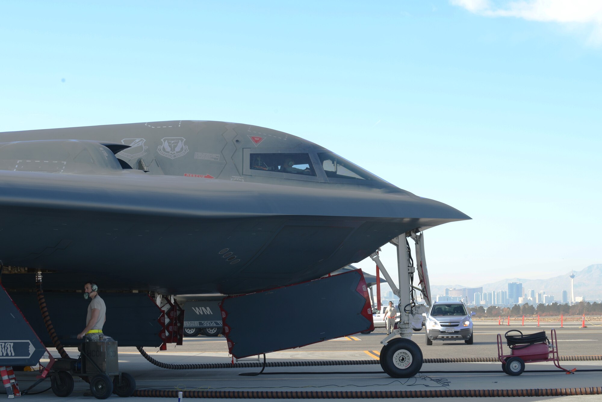 Airman 1st Class Matthew Helms, 509th Aircraft Maintenance Squadron crew chief from Whiteman Air Force Base, Mo., inspects the underside of a B-2 Spirit before a flight Feb. 10, 2014, at Nellis  AFB, Nev. More than 100 members are currently temporary duty from Whiteman AFB, participating in the combat exercise Red Flag 14-1. The B-2 is a multi-role bomber capable of delivering both conventional and nuclear munitions. Red Flag gives military members the opportunity to experience realistic, stressful combat situations in a controlled environment to increase their ability to complete missions and return home. (U.S. Air Force photo by Senior Airman Benjamin Sutton/Released) 
