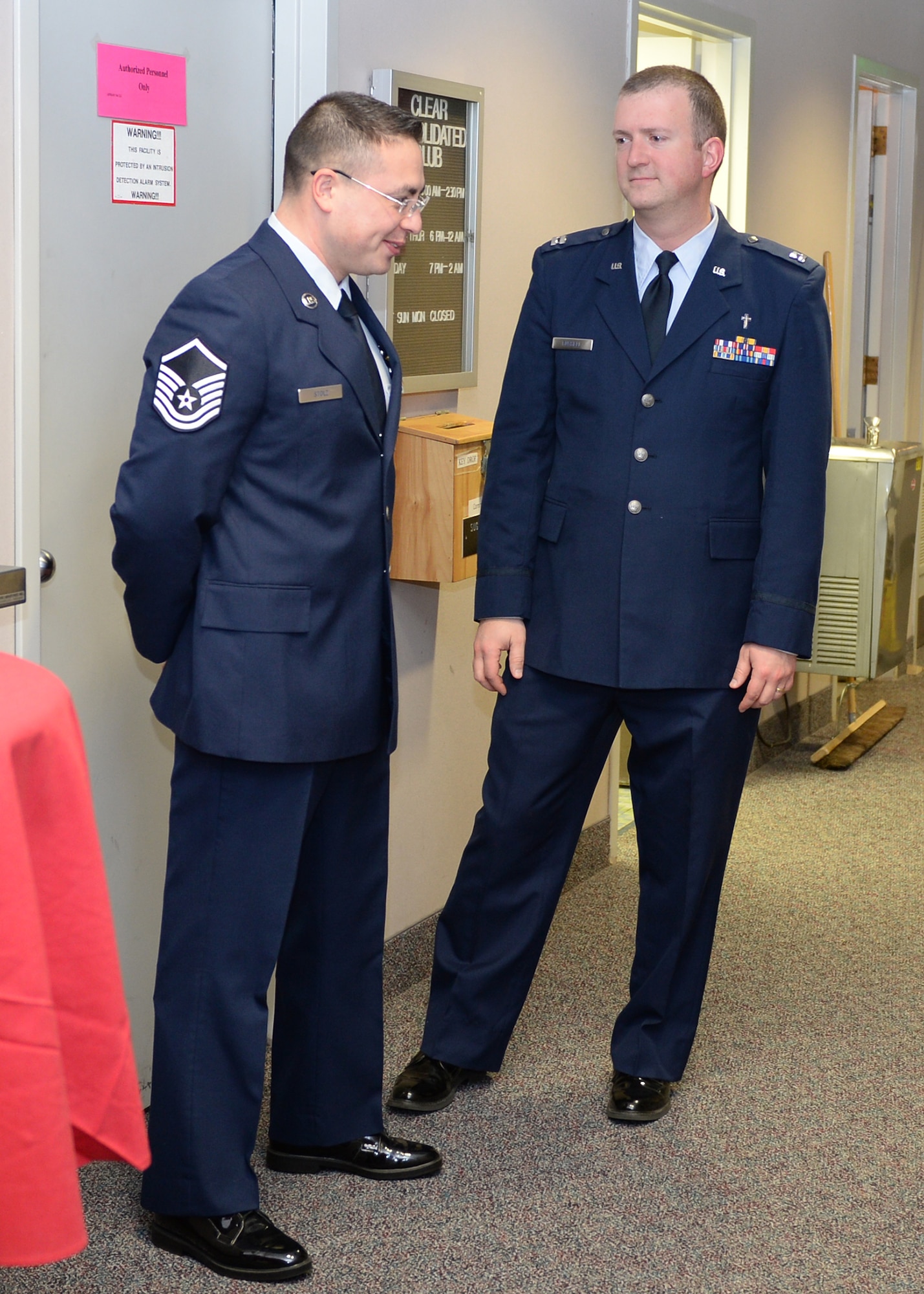 Chaplain (Capt.) Thomas Fussell, 354th Fighter Wing protestant chaplain, speaks with Master Sgt. John Stolz, 213th Space Warning Squadron NCO in charge of security forces resources, after a memorial service Feb. 6, 2014 at Clear Air Station, Alaska. Chaplains from Eielson Air Force Base and Joint Base Elmendorf Richardson, Alaska, travel the icy roads to the remote radar station every other week to aid the more than 300 Airmen stationed there. (U.S. Air Force photo by Senior Airman Shawn Nickel/Released)
