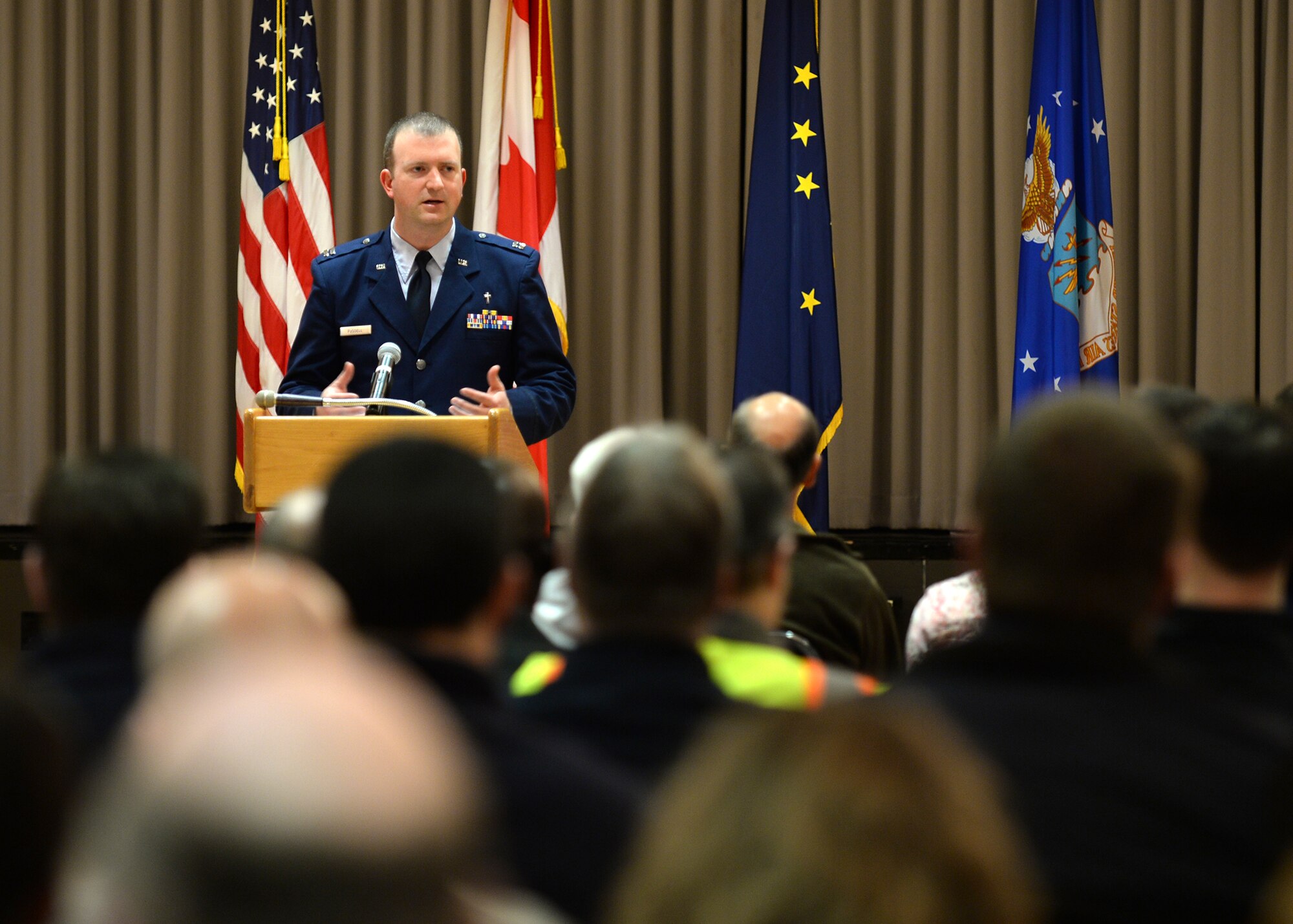 Chaplain (Capt.) Thomas Fussell, 354th Fighter Wing protestant chaplain, gives a eulogy Feb. 6, 2014, at a memorial service for a civilian Airman of Clear Air Station, Alaska. Chaplains travel to the remote location to provide spiritual care for the more than 300 Airmen who maintain and operate the Air Force asset. (U.S. Air Force photo by Senior Airman Shawn Nickel/Released)