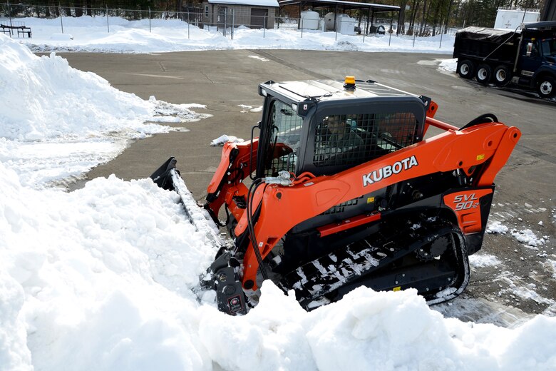 Senior Airman Christopher Cangemi, 103rd Civil Engineer Squadron, practices maneuvering one of two new Kabota skid steer machines that the squadron can use if called to clear roads and grounds in the aftermath of a natural disaster or major weather event on Feb. 12, 2014.  Despite their current high state of readiness and their proven track record of storm recovery service to the state and community, the unit will soon conduct a three-day course to train additional volunteers from other units of the Connecticut Air National Guard to increase the available pool of skilled team members for recovery operations in the event of a natural disaster, on or off base.  (U.S. Air National Guard photo by Master Sgt. Erin McNamara)