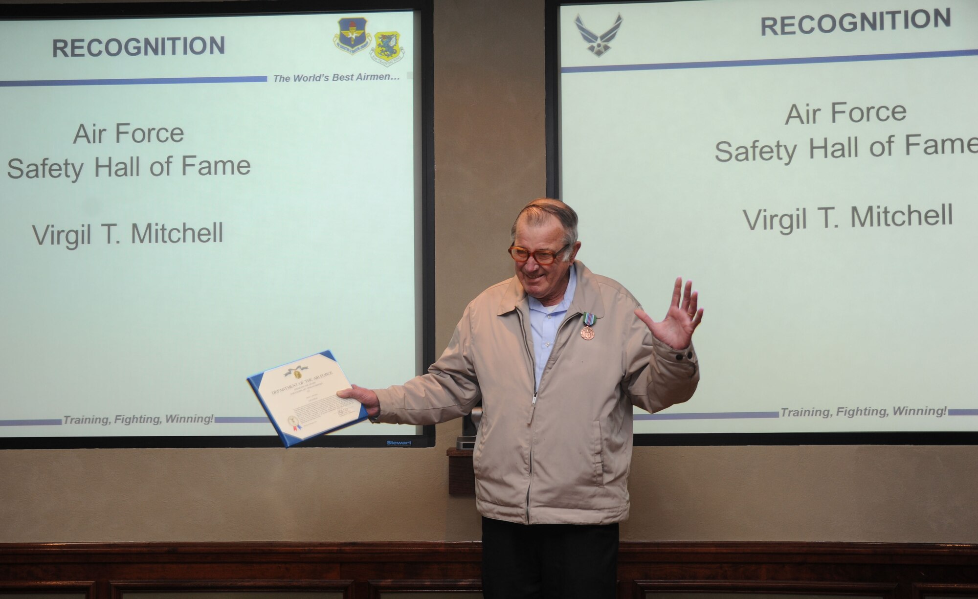 Virgil Mitchell, 81st Training Wing safety office, is recognized for his induction into the Air Force Safety Hall of Fame during the 81st TRW staff meeting Feb. 12, 2014, Keesler Air Force Base, Miss.  Mitchell also received the Exemplary Civilian Service Award. (U.S. Air Force photo by Kemberly Groue)