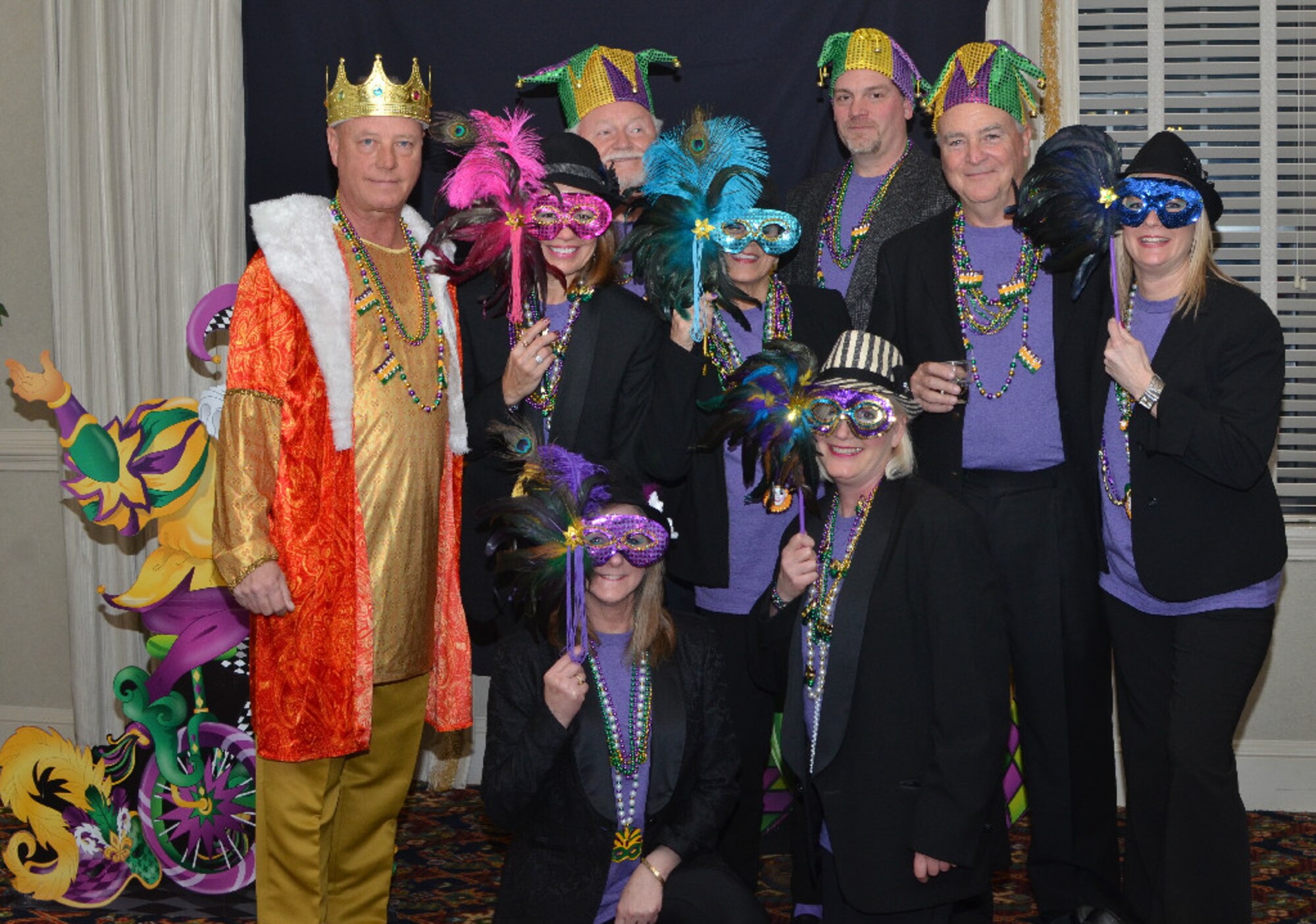 Members of the Langley Officers’ Spouses’ Club strike a pose during the “Mardi Gras on Bourbon Street” event at Langley Air Force Base, Va.  The LOSC hosts at least one social every month for its members, as well as fundraising events to finance projects on and around Langley. (Courtesy photo/Released)