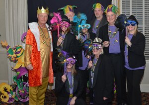 Members of the Langley Officers’ Spouses’ Club strike a pose during the “Mardi Gras on Bourbon Street” event at Langley Air Force Base, Va.  The LOSC hosts at least one social every month for its members, as well as fundraising events to finance projects on and around Langley. (Courtesy photo/Released)