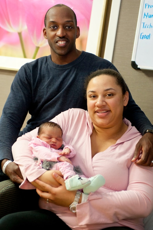 U.S. Navy Petty Officer 1st Class Kareem Castle, Pre-commissioning Unit Gerald R. Ford operation specialist, and wife, Faryn Castle, hold their 2-day-old daughter, Elizabeth, at Langley Air Force Base, Va., Feb. 10, 2014. The Castles will spend Valentine’s Day with their two daughters, Elizabeth and two-year-old Olivia. (U.S. Air Force photo by Staff Sgt. Stephanie R. Plichta/Released)