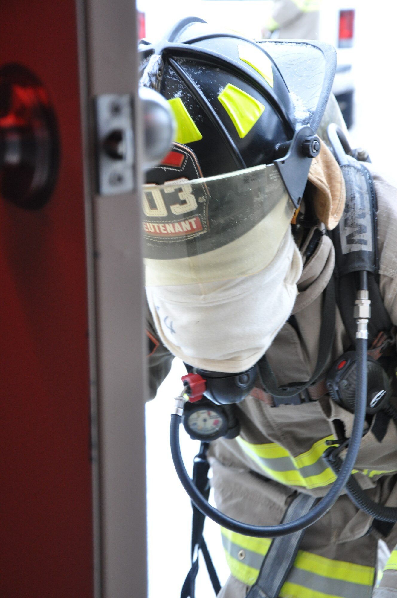 GOODFELLOW AIR FORCE BASE, Texas – Chris Little, San Angelo Fire Department recruit, crawls into the search and rescue trainer at the Louis F. Garland DoD Fire Academy here Feb. 6. Little and the other recruits went through the trainer blindfolded to help simulate a smoke-filled environment, which helped test the use of their other senses. (U.S. Air Force photo/ Senior Airman Joshua Edwards)