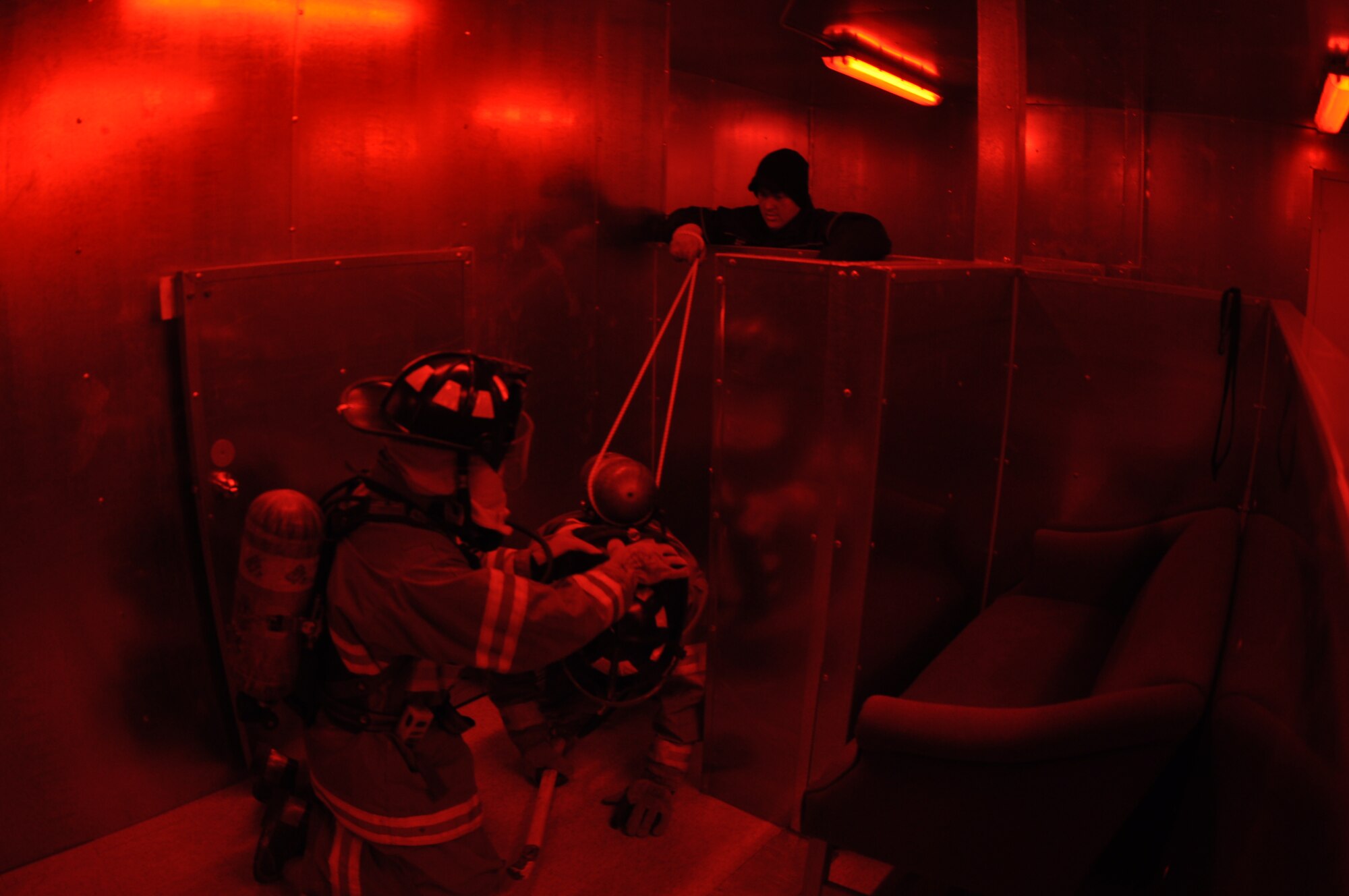 GOODFELLOW AIR FORCE BASE, Texas – Lt. Mac McElroy, San Angelo Fire Department rescue officer, lassos SAFD recruit Kellen Gierke’s tank to simulate entanglement during search and rescue training at the Louis F. Garland DoD Fire Academy here Feb. 6. McElroy used the rope to test Gierke’s ability to properly communicate with his blindfolded partner. (U.S. Air Force photo/ Senior Airman Joshua Edwards)