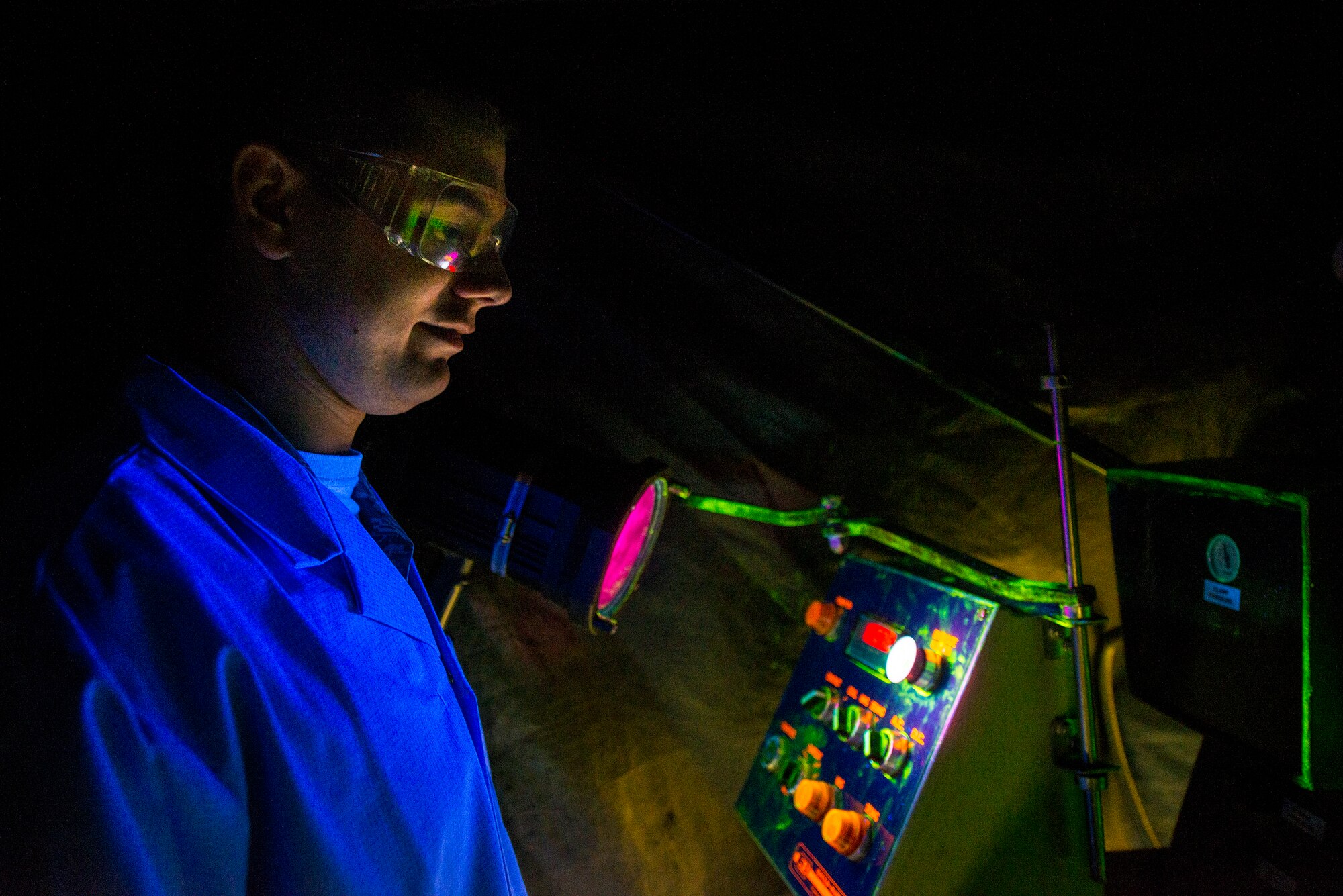 U.S. Air Force Airman Nicholas Burgess, 23d Equipment Maintenance Squadron non-destructive inspection apprentice, demonstrates the use of a magnetic particle unit at Moody Air Force Base, Ga., Feb. 11, 2014. The magnetic particle unit uses brass coils to push particle-rich dyes into cracks and crevices on metal aircraft parts, identifying potential hazards before they become an issue. (U.S. Air Force photo by Airman 1st Class Ryan Callaghan/Released)
