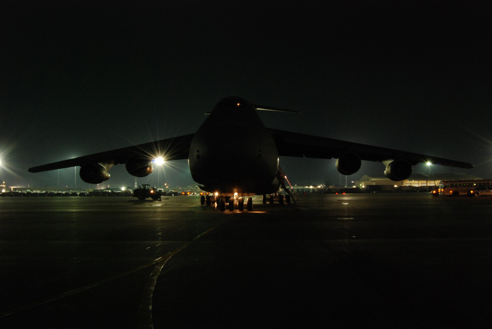 A C-5B Galaxy is parked on the flight line ramp at Bagram Airfield, Afghanistan, Feb. 11, 2014. Aerial port Airmen off-loaded multiple pallets of cargo. (U.S. Air Force photo by Capt. Brian Wagner/Released)