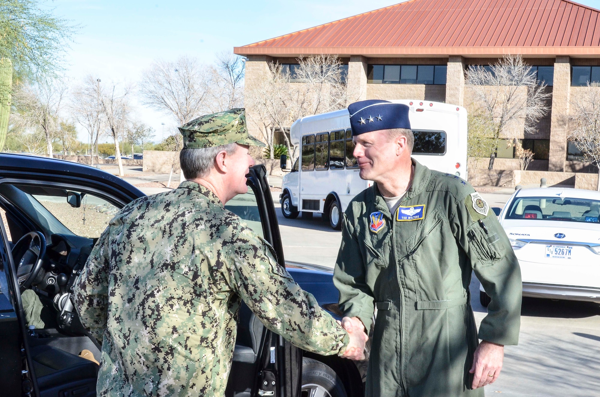 U.S. Navy Admiral William McRaven (left), Commander of U.S. Special Operations Command, greets U.S. Air Force Lt. Gen. Tod Wolters, 12th Air Force (Air Forces Southern) commander, upon arrival to Davis-Monthan AFB, Ariz., Feb. 7, 2014. During the visit, the admiral toured of the 612th Air and Space Operations Center and, spoke with AFSOUTH Airmen about their mission as the air component of U.S. Southern Command. (U.S. Air Force photo by Staff Sgt. Adam Grant/Released) 