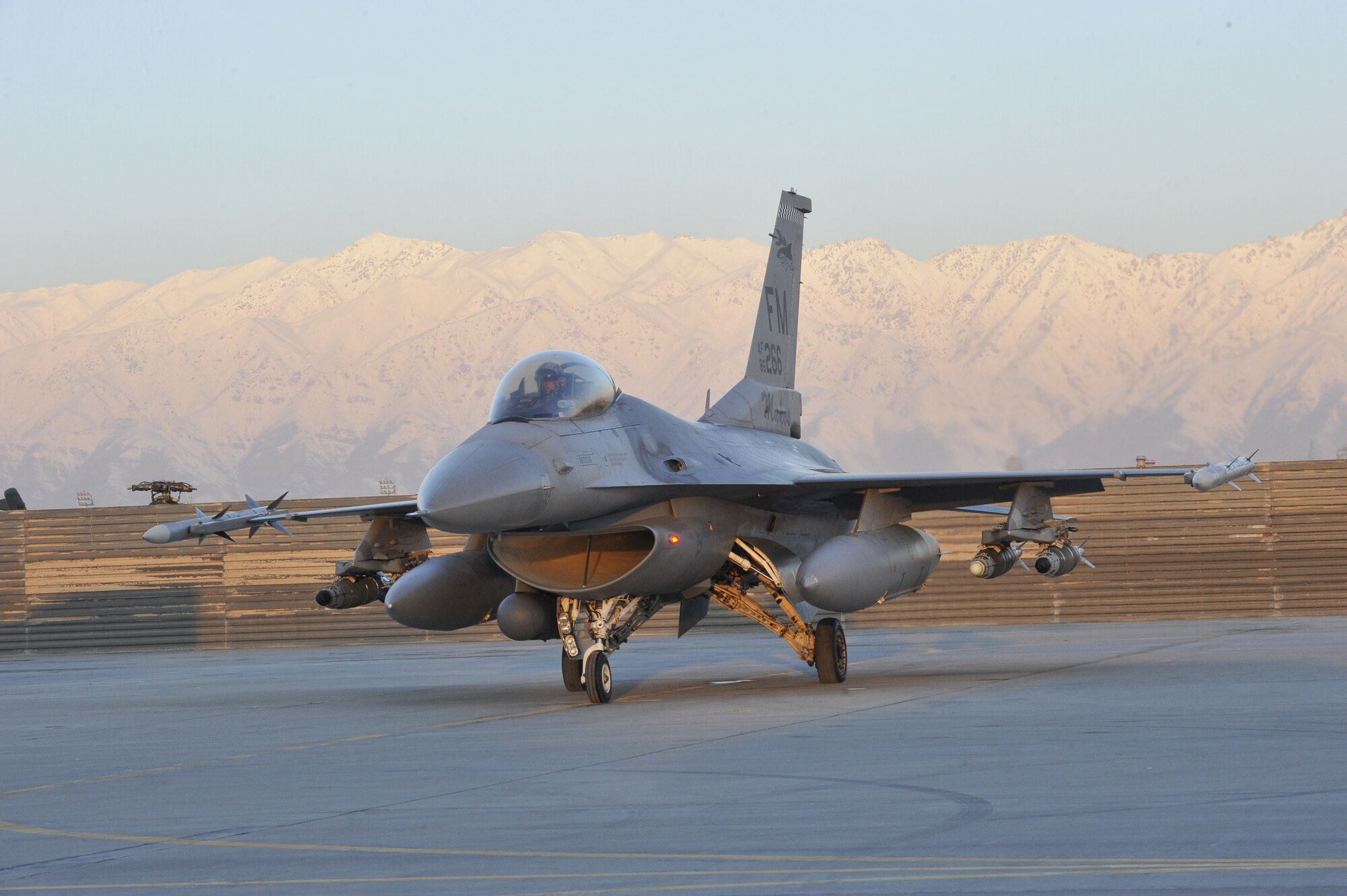 A U.S. Air Force F-16 Fighting Falcon takes off on a mission at dawn from Bagram Airfield, Afghanistan, Feb. 11, 2014. The aircraft and crews at Bagram are prepared to fly 24 hours a day. (U.S. Air Force photo by Senior Master Sgt. Gary J. Rihn/Released)