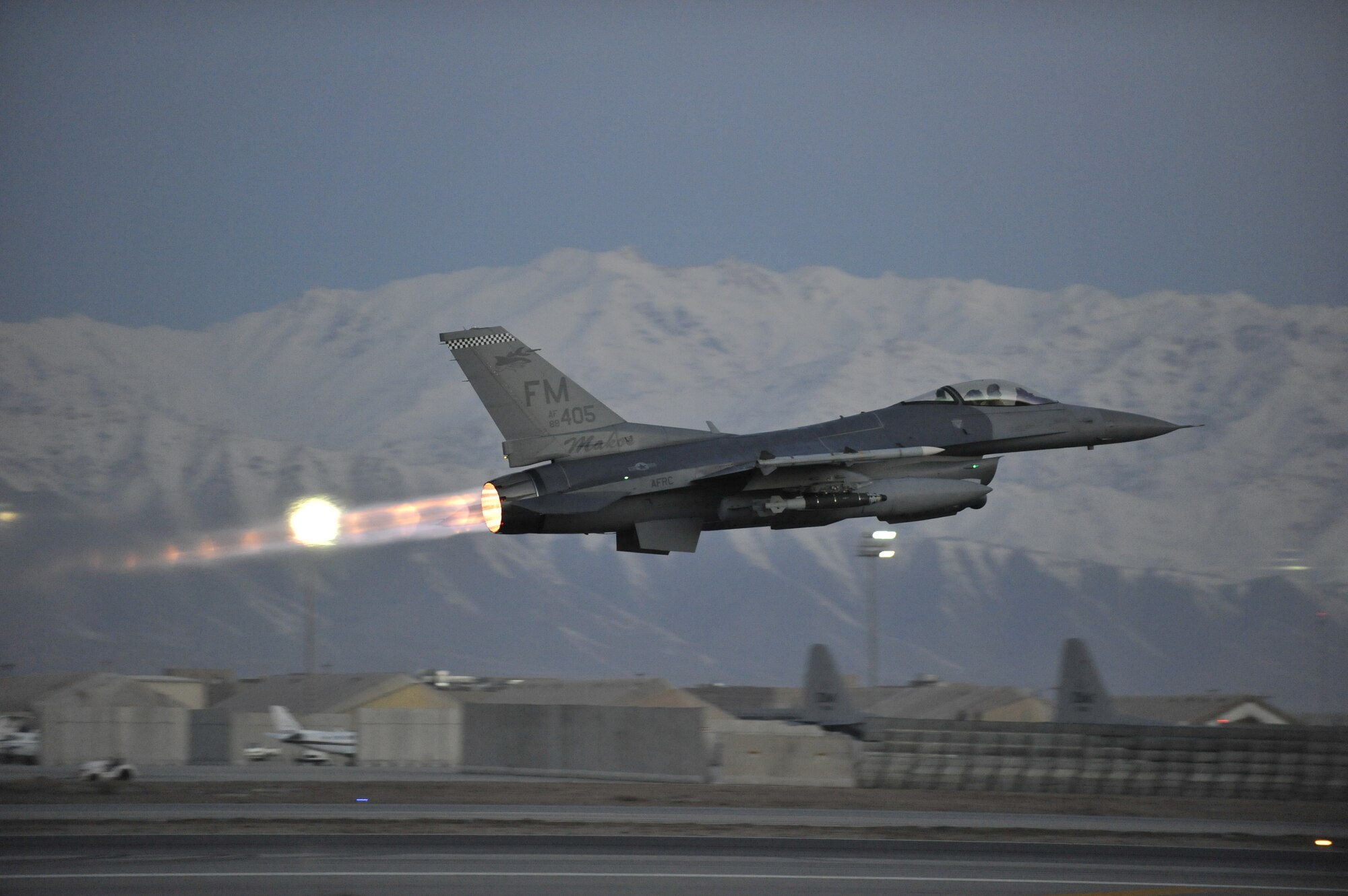 A U.S. Air Force F-16 Fighting Falcon takes off on a mission at dawn from Bagram Airfield, Afghanistan, Feb. 11, 2014. The aircraft and crews at Bagram are prepared to fly 24 hours a day. (U.S. Air Force photo by Senior Master Sgt. Gary J. Rihn/Released)