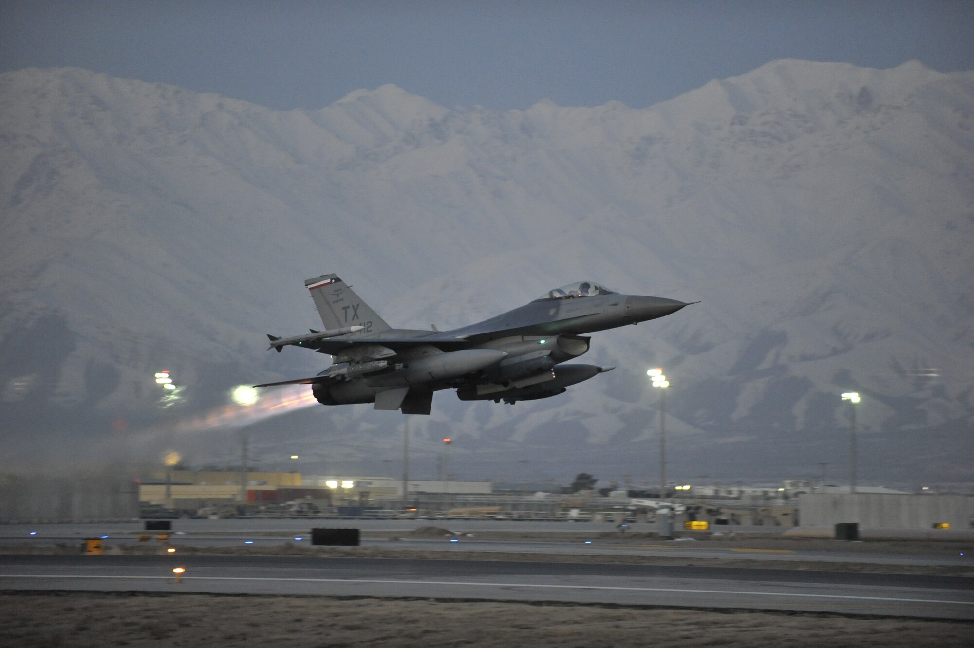 A U.S. Air Force F-16 Fighting Falcon takes off on a mission at dawn from Bagram Airfield, Afghanistan, Feb. 11, 2014. The aircraft and crews at Bagram are prepared to fly 24 hours a day. (U.S. Air Force photo by Senior Master Sgt. Gary J. Rihn/Released)