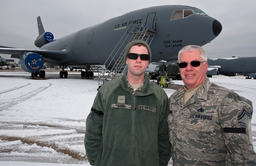 Airman Andrew Nanni, 714th Aircraft Maintenance Squadron, poses next to his father, Master Sgt.  Anthony Nanni, 714th Aircraft Maintenance Squadron, before accompanying him on his “Fini” flight. (U.S. Air Force photo by Christian DeLuca/released)