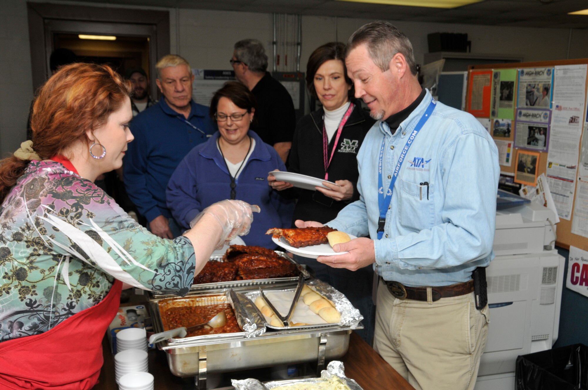 Aerospace Testing Alliance (ATA) recently held a special barbecue luncheon for employees at the Chem/Met Lab to express appreciation for a couple of major efforts. The Chemicals Lab successfully received recertification by the American Industrial Hygiene Association (AIHA) and the Non-Destructive Testing (NDT) lab’s X-ray support of a recent solid rocket motor. ATA Director Lynn Moran, Deputy Director Debbie Bayer and Branch Manager Walt Bishop say they organized the luncheon to recognize the Chem Lab employees for their continued excellence of work. AIHA certification is difficult to obtain and establishes high standards of performance for laboratories; it promotes the production of quality data for use in evaluating exposures that impact public health, the environment and public resources. The NDT folks were recognized for successfully meeting a customer’s requirement on schedule which was a complex task requiring experience and flexibility. (Photo by Rick Goodfriend)