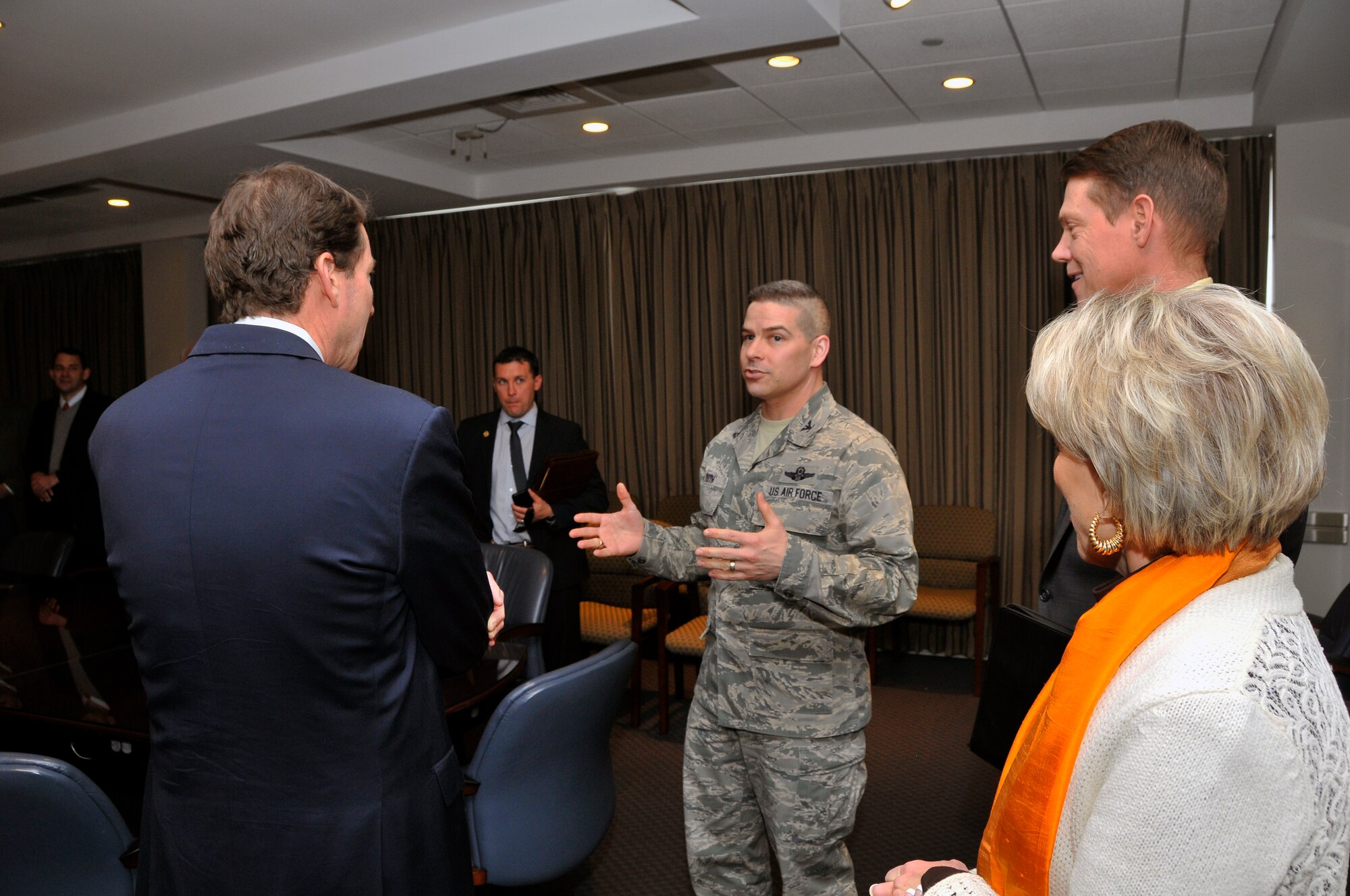 The Tennessee Economic and Community Development (ECD) Commissioner Bill Hagerty (far left) recently met with Arnold Engineering Development Complex (AEDC) officials to get an update on the Complex. The commissioner and several of his staff members met with AEDC Commander Col. Raymond Toth (3rd from left), Dr. Douglas Blake (2nd from right), Col. James Krajewski, Clark Brandon, John Laviolette, and Jason Austin (not shown). Each time the legislature goes into recess, the commissioner and his team hit the road to talk with businesses across the state. One topic included in their discussion at AEDC was the Enhanced Use Lease Program which allows the Department of Defense to lease land or facilities to public entities or private developers. Area ECD from Coffee and Franklin counties and local government representatives also attended the meeting. (Photo by Jacqueline Cowan)