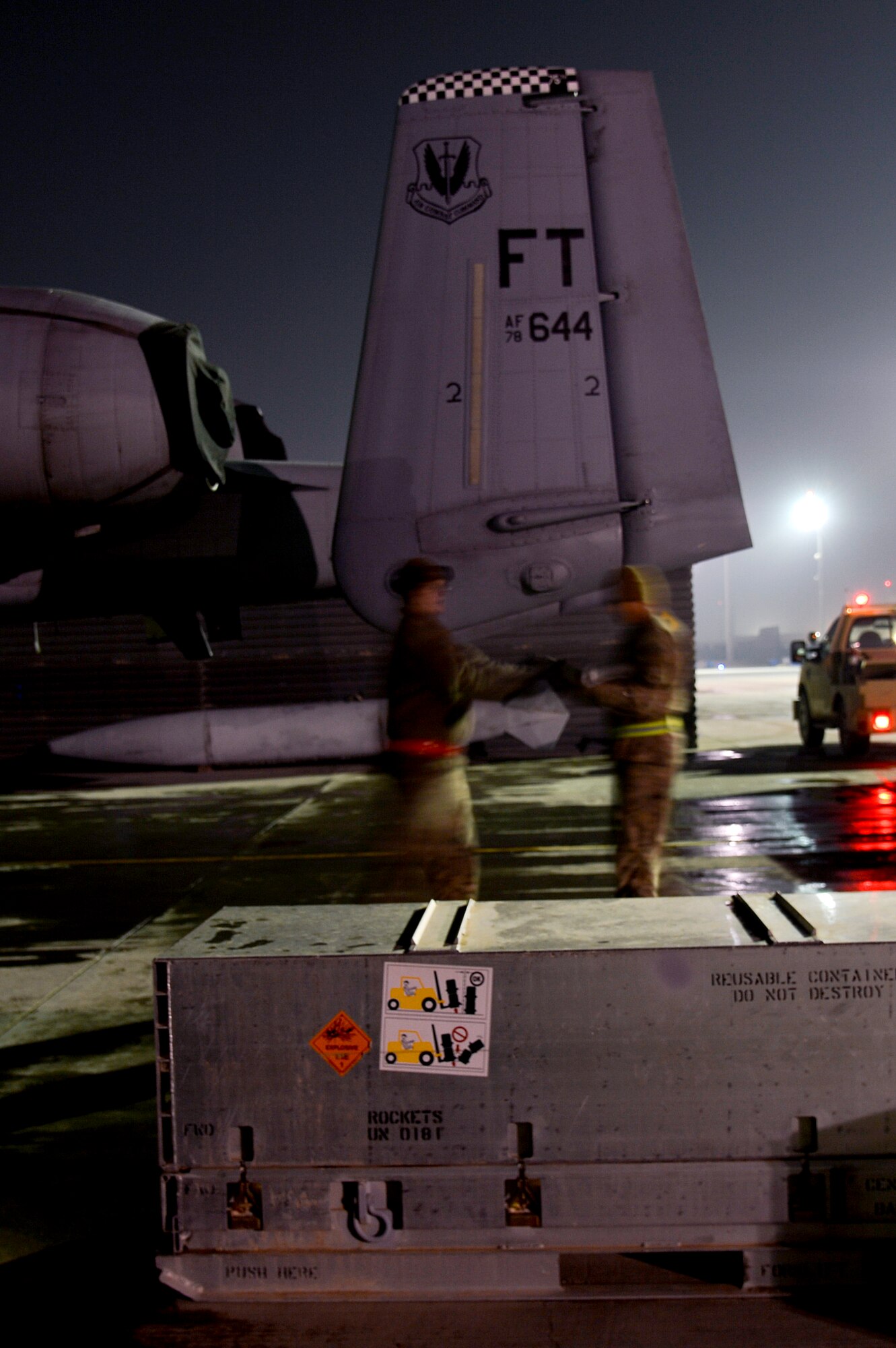U.S. Air Force Airmen assigned to the 455th Expeditionary Aircraft Maintenance Squadron perform a weapons reload at Bagram Airfield, Afghanistan, Feb. 10, 2014. The Airmen performing the reload are deployed from Moody Air Force Base, Ga. (U.S. Air Force photo by Senior Airman Kayla Newman/Released)