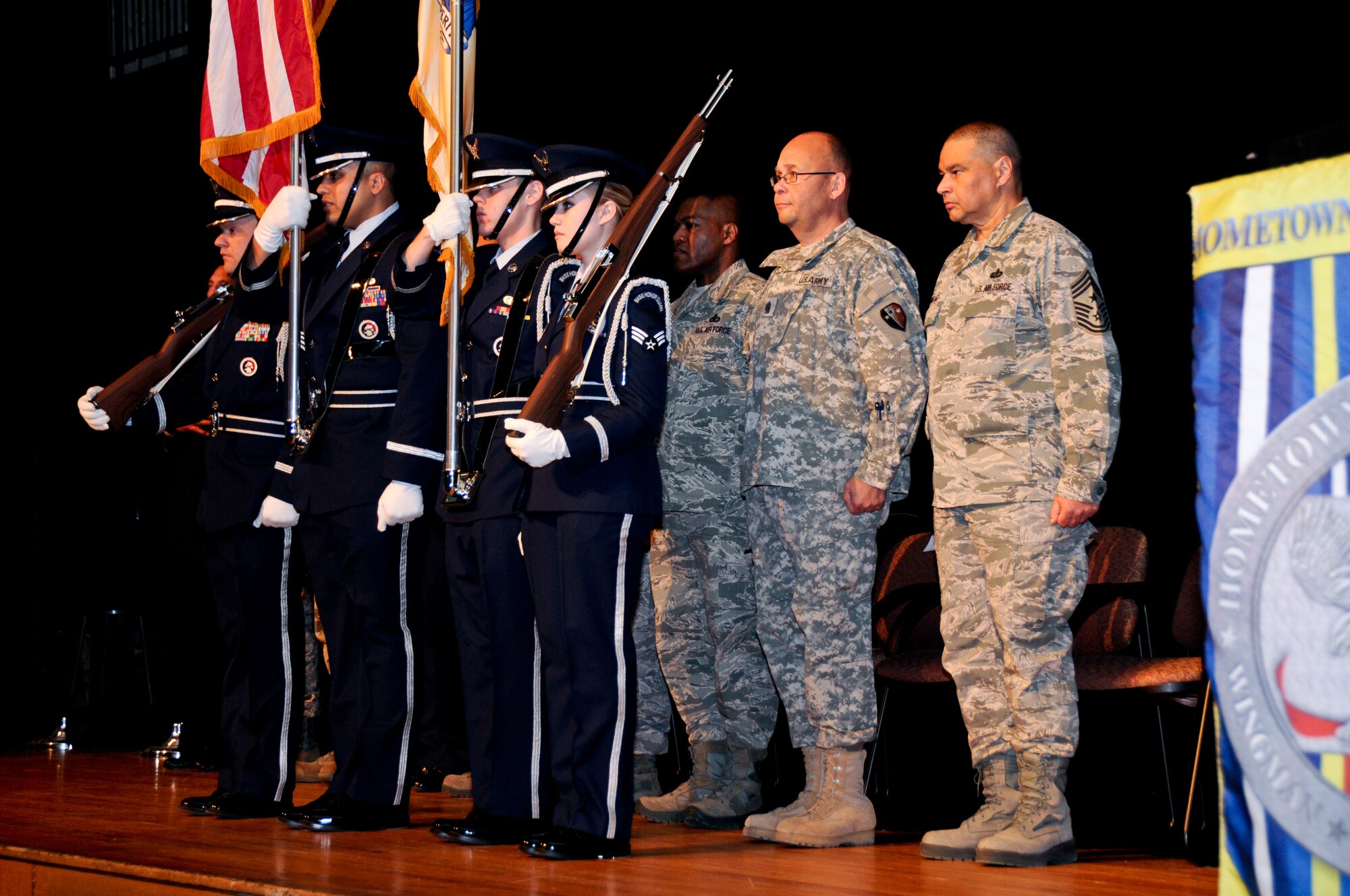 U.S. Air Force airmen from the New Jersey Air National Guard's 177th Fighter Wing Honor Guard place the colors at the beginning of the Hometown Heroes Salute awards presentation at Absegami High School in Galloway, N.J. on Feb. 9.  (U.S. Air National Guard photo by Airman 1st Class Shane Karp/Released)