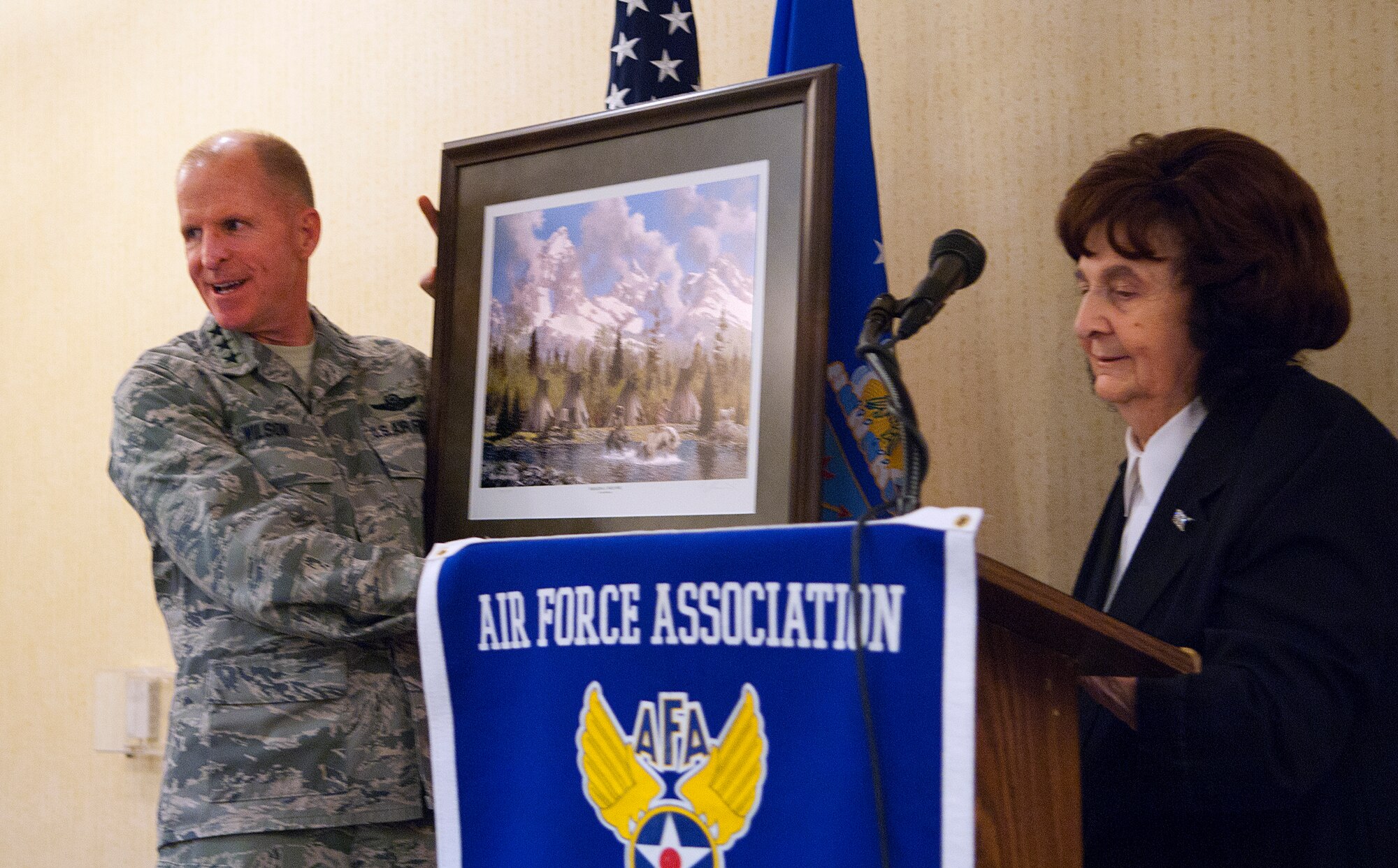 140211-F-JW079-058
Lt. Gen. Stephen Wilson, commander of Air Force Global Strike Command, holds up a painting presented to him by Irene Johnigan, Cowboy Chapter of the Air Force Association president, after he spoke at the chapter’s Community Partners Recognition Luncheon Feb. 11, 2014; at the Plains Hotel in Cheyenne, Wyo. Wilson was in Cheyenne meeting with the commanders and Airmen of the 20th Air Force and 90th Missile Wing. (U.S. Air Force photo by R.J. Oriez)
