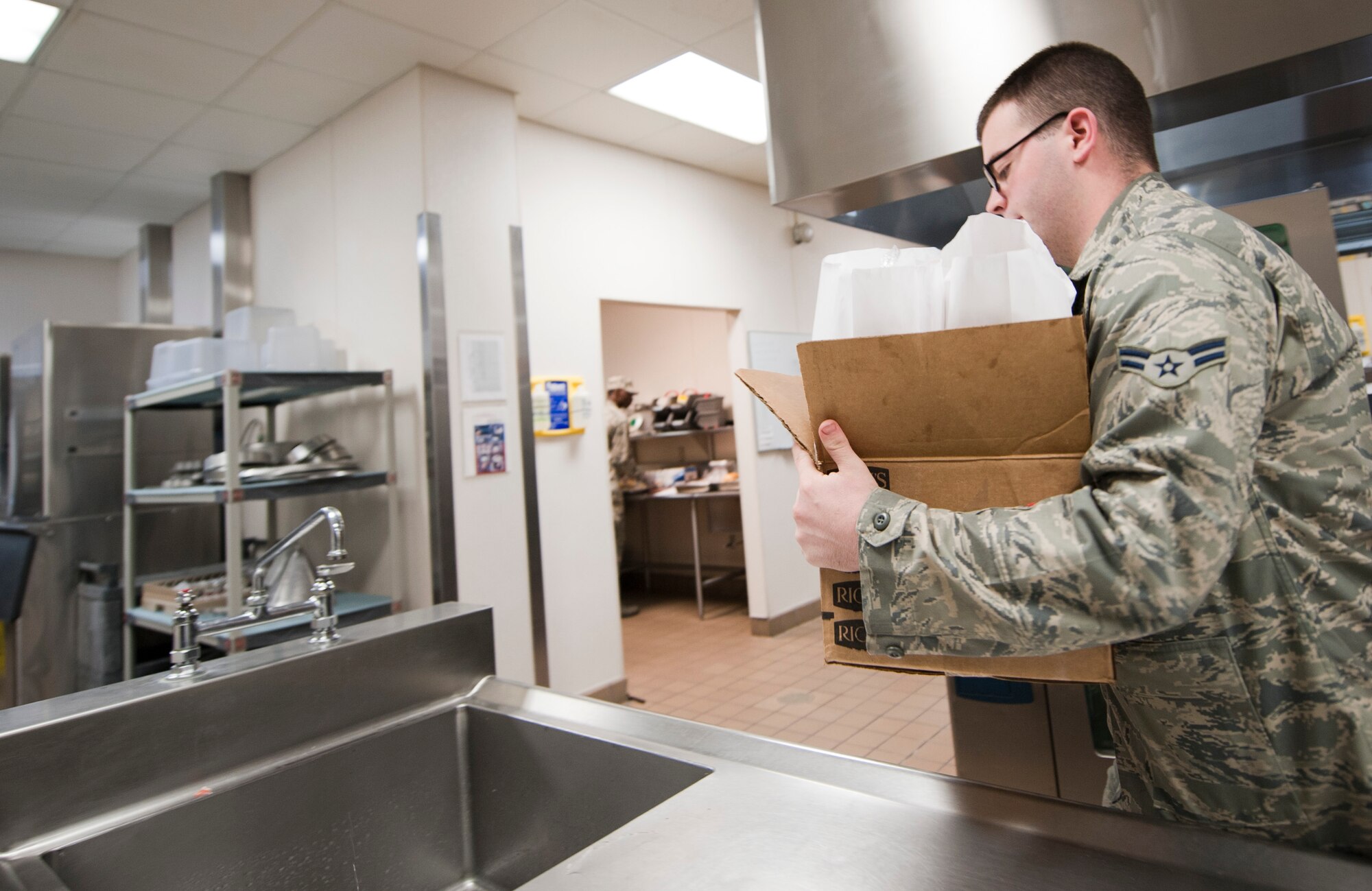 Airman 1st Class Daniel Allen, 1st Special Operations Equipment Maintenance Squadron armament apprentice, picks up flight meals for his shop at the Riptide Dining Facility on Hurlburt Field, Fla., Feb. 6, 2014. Maintainers are one of the main groups of Airmen who order flight meals from the flight kitchen. (U.S. Air Force photo/Senior Airman Krystal M. Garrett)  