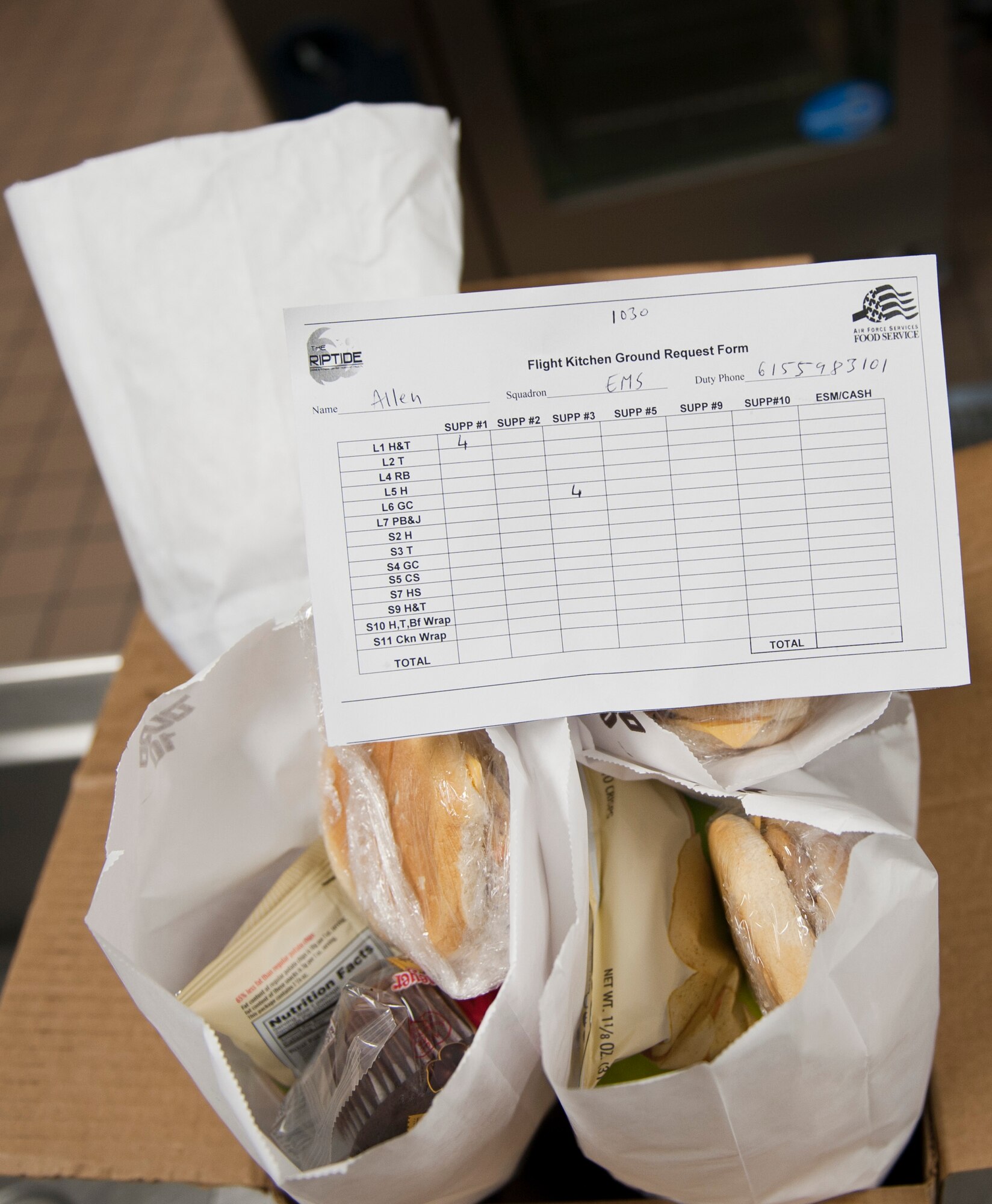 A box of flight meals sits on a counter at the Riptide Dining Facility on Hurlburt Field, Fla., Feb. 6, 2014. Maintainers, aircrew members and Security Forces Airmen order meals from the flight kitchen. (U.S. Air Force photo/Senior Airman Krystal M. Garrett)