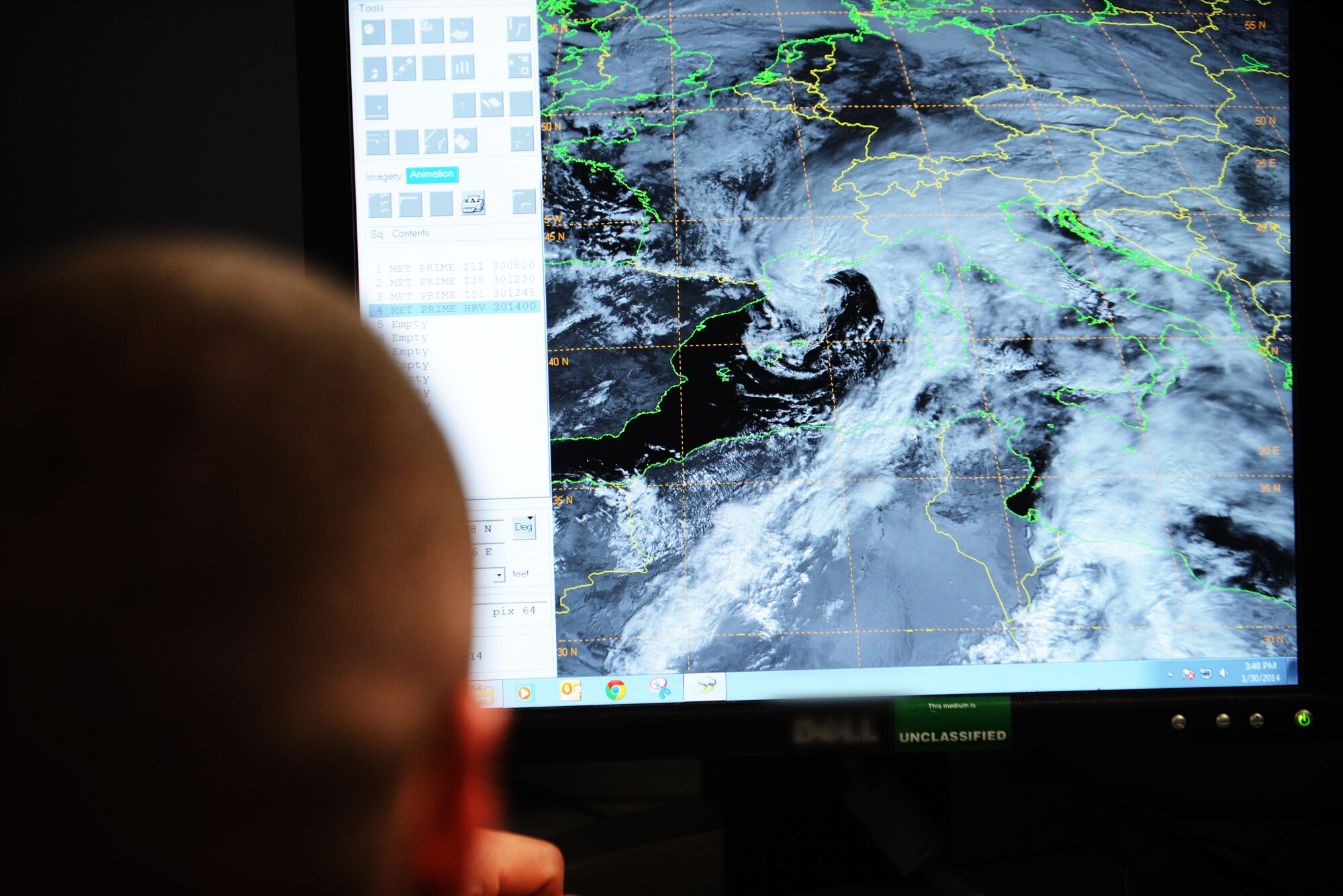 First Lieutenant David DeMeuse, 31st Operations Support Squadron Weather Flight commander, observes cloud patterns over Italy using real-time satellite imagery, Jan. 30, 2014, at Aviano Air Base, Italy. The weather flight employs the "eyes forward" approach using real-time radar, satellite imagery, sensor readouts and visual observations to tailor weather conditions specifically for the 31st Fighter Wing. (U.S. Air Force photo/Airman 1st Class Ryan Conroy) 