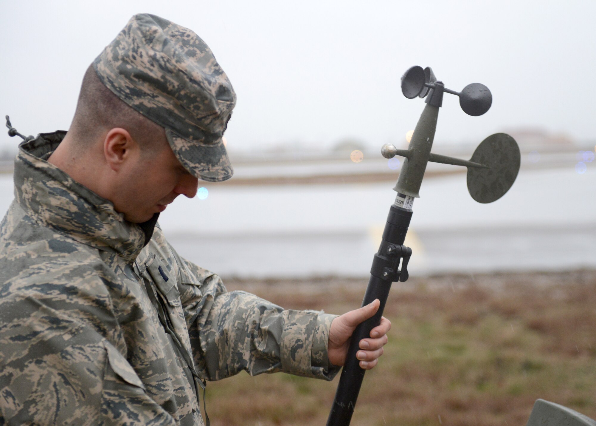 First Lieutenant  David DeMeuse, 31st Operations Support Squadron Weather Flight commander, sets up a TMQ-53 automated observing weather station, Jan. 30, 2014, at Aviano Air Base, Italy. The weather station automatically takes readings and processes them through a computer, which provides weather technicians more time to analyze weather data. (U.S. Air Force photo/Airman 1st Class Ryan Conroy) 