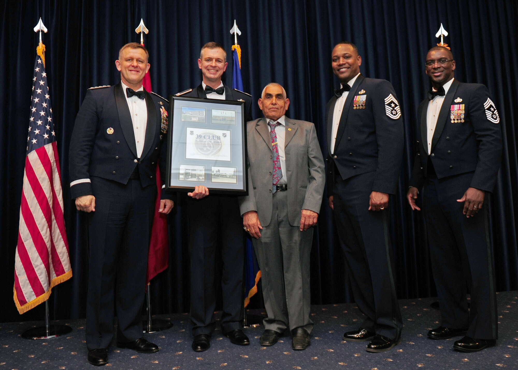 Cemil Filiz, 728th Air Mobility Squadron, is welcomed into the 39 Club by U.S. Air Forces in Europe and 39th Air Base Wing senior leadership at the Combined Club Complex Feb. 4, 2014. The 39 Club recognizes local national employees who have served on Incirlik Air Base for nearly four decades or longer. (U.S. Air Force photo by Airman 1st Class Nicole Sikorski/Released)
