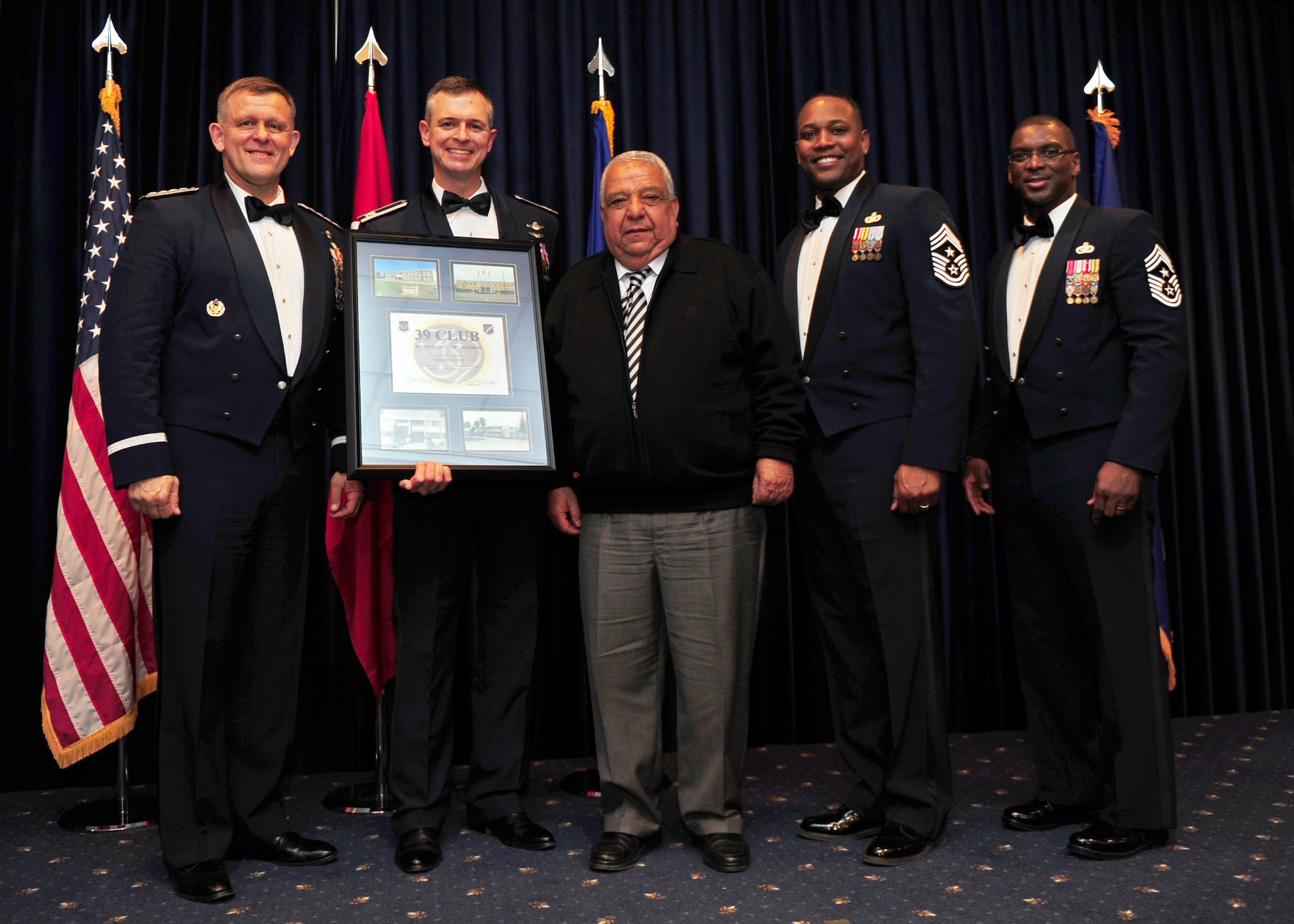 Necdet Uslu, 728th Air Mobility Squadron, is welcomed into the 39 Club by U.S. Air Forces in Europe and 39th Air Base Wing senior leadership at the Combined Club Complex Feb. 4, 2014. The current members of the 39 Club have between 42 and 47 years of service on Incirlik Air Base. (U.S. Air Force photo by Airman 1st Class Nicole Sikorski/Released)