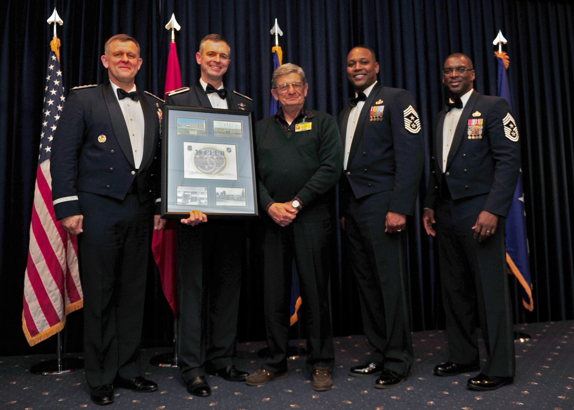 Muhtar Gucum, 39th Security Forces Squadron, is welcomed into the 39 Club by U.S. Air Forces in Europe and 39th Air Base Wing senior leadership at the Combined Club Complex Feb. 4, 2014. The 39 Club recognizes local national employees who have served on Incirlik Air Base for nearly four decades or longer. (U.S. Air Force photo by Airman 1st Class Nicole Sikorski/Released)