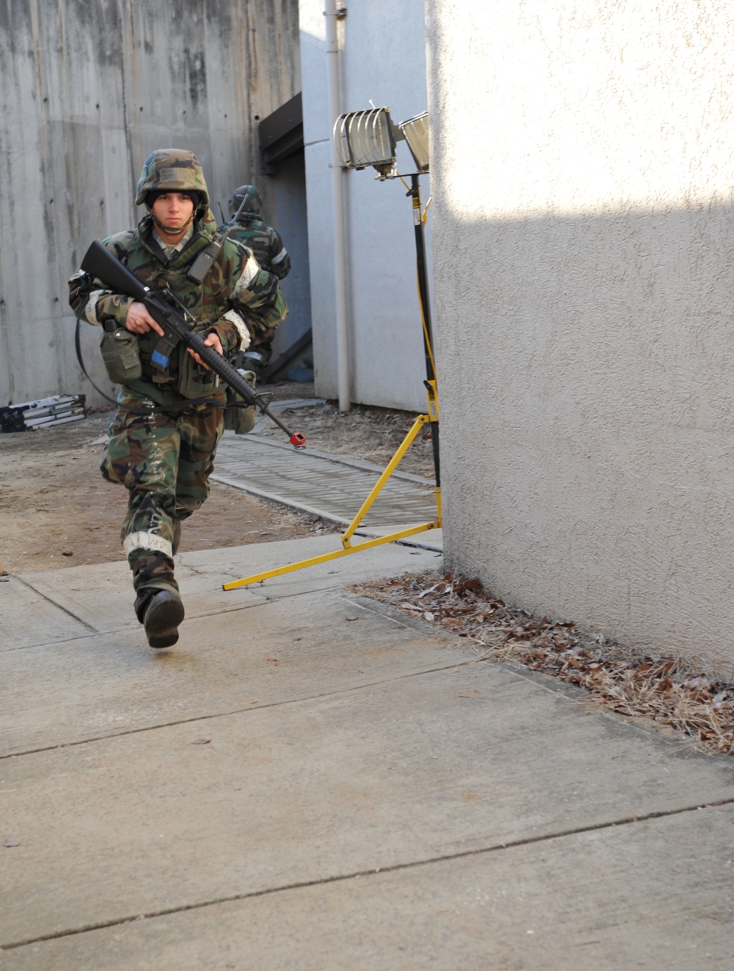 A member of the 51st Communications Squadron runs out of Bldg. 949 as part of a mock structure fire and bug-out scenario during Operational Readiness Exercise Beverly Midnight 14-02 at Osan Air Base, Republic of Korea, Feb. 11, 2014. The situation tested the ability of the building’s occupants to exit safely and efficiently in the midst of an emergency while maintaining absolute accountability. (U.S. Air Force photo/Airman 1st Class Ashley J. Thum)