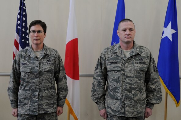 The Air Force Civil Engineer, Maj. Gen. Theresa C. Carter, and Senior Master Sgt. Matthew L. Newlon, 35th Civil Engineering Squadron infrastructure superintendent, stand at attention during a medal presentation at Misawa Air Base, Japan, Feb. 2, 2014. Carter presented the BSM to Newlon during her three-day visit to the base. (U.S. Air Force photo/Airman 1st Class Patrick S. Ciccarone) 