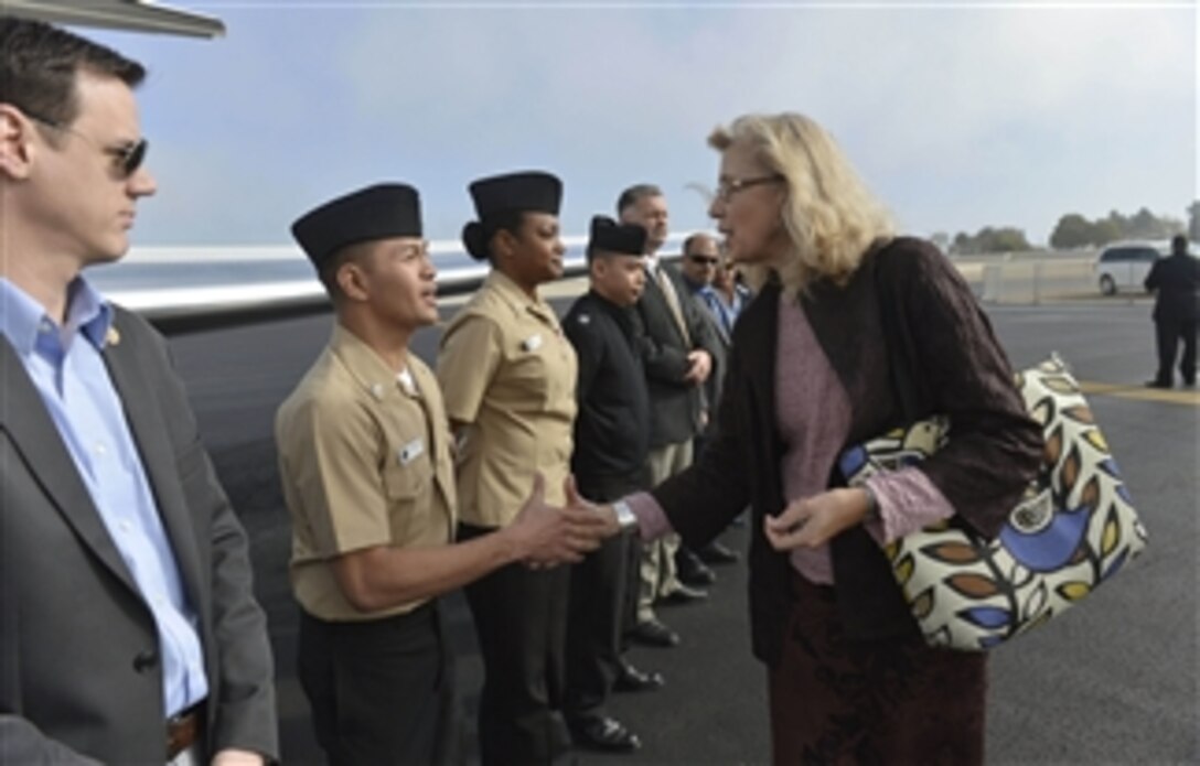 Acting Deputy Defense Secretary Christine H. Fox thanks drivers and security personnel as she prepares to depart San Diego, Feb. 10, 2014. Fox traveled to the city to deliver remarks at the Western Conference and Exposition, the largest event of its kind on the West Coast for sea services and supporting contractors.